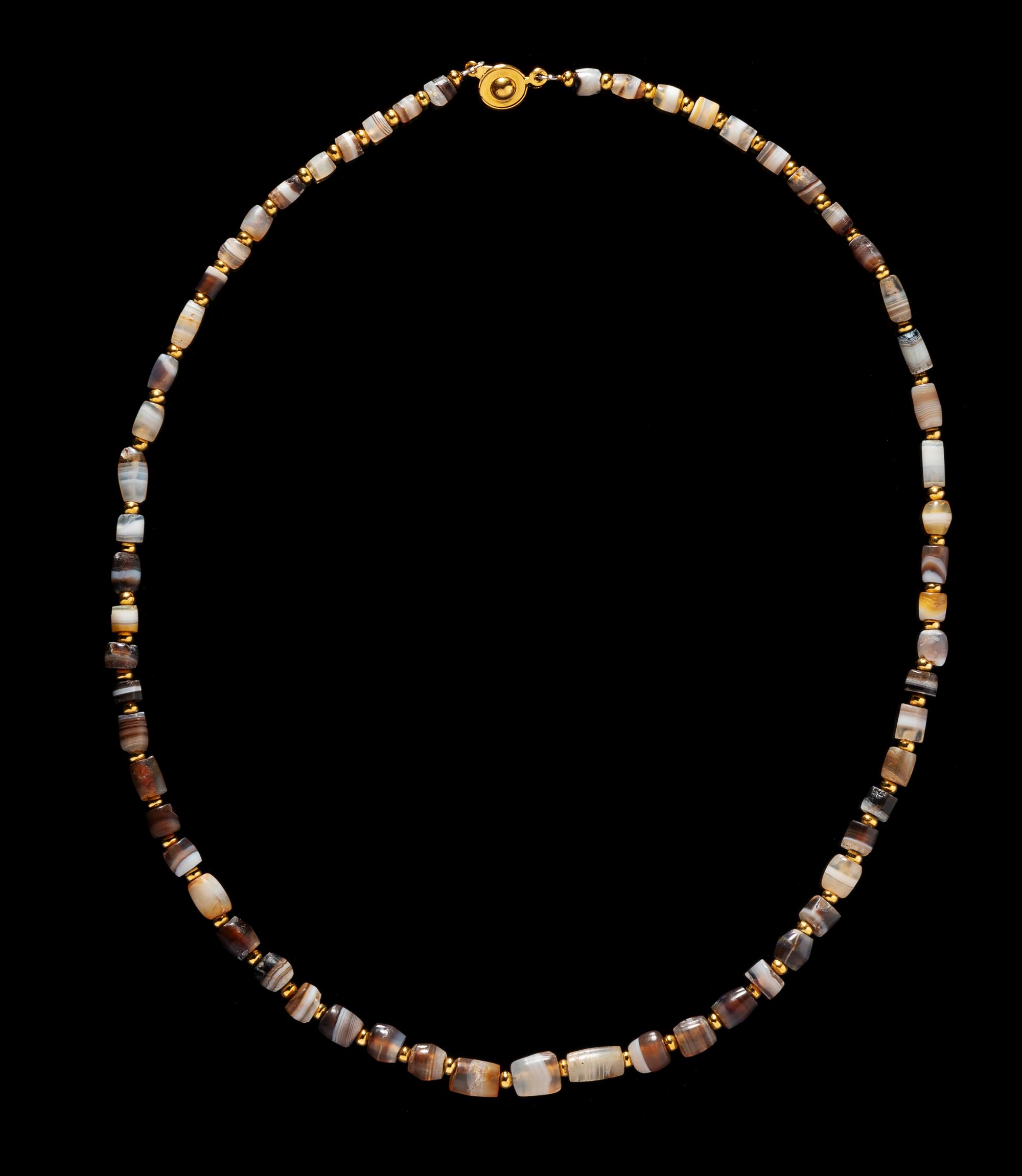 A Western Asiatic Banded Agate Necklace