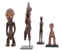 Four Carved Wood African Figures Height of tallest 15 1/2 inches.