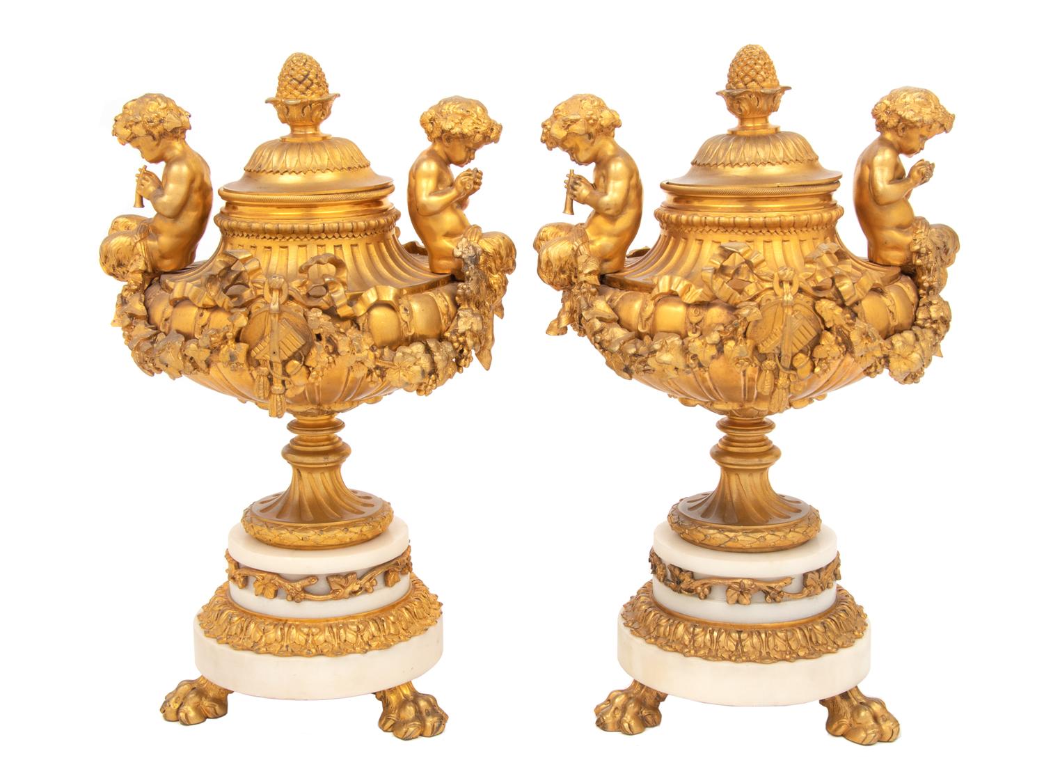 A Pair of Louis XVI Style Gilt Bronze and Marble Covered Urns