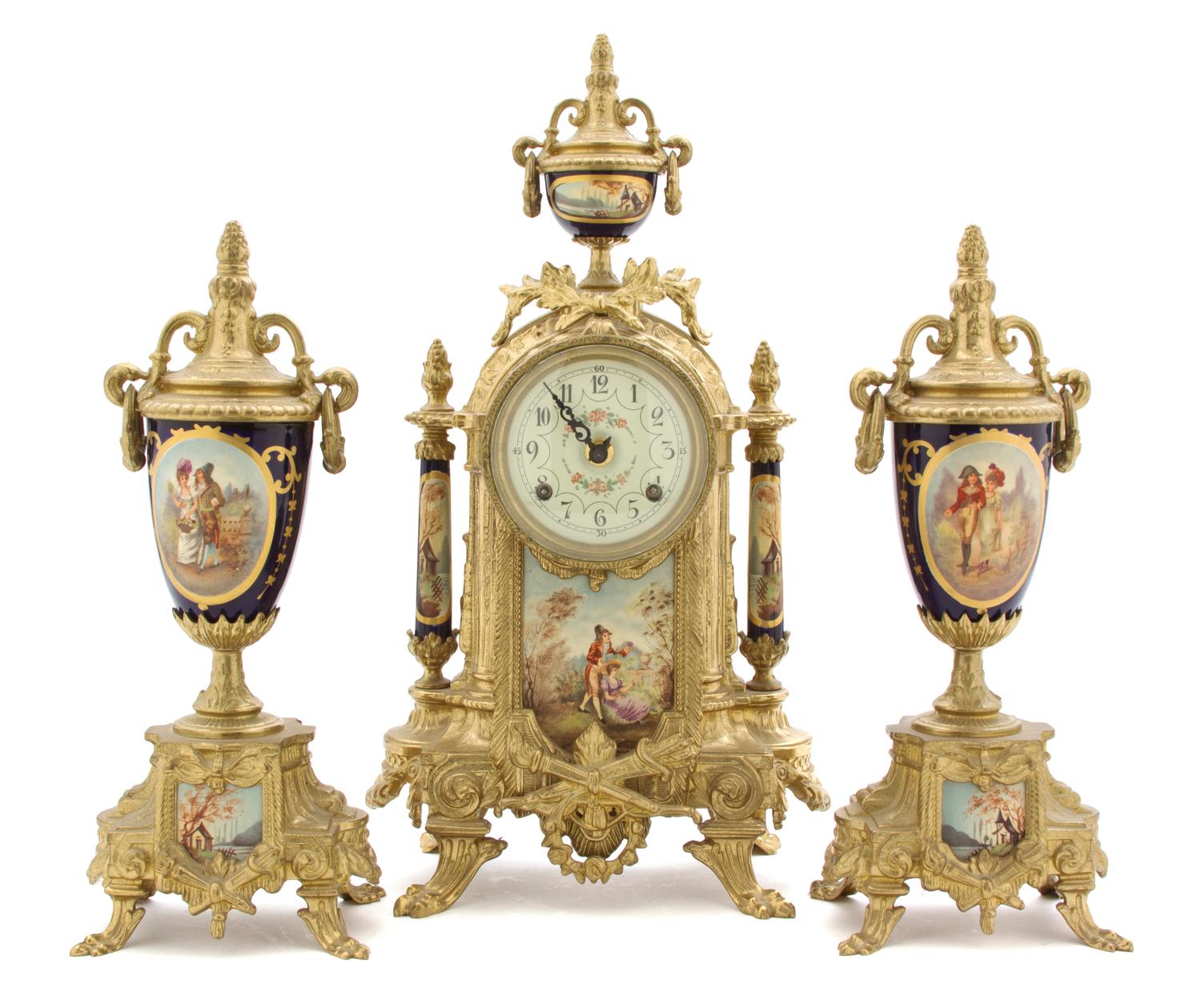 A Continental Sevres Style Porcelain and Gilt Metal Mounted Clock Garniture, Height of first 16 1/4 inches.