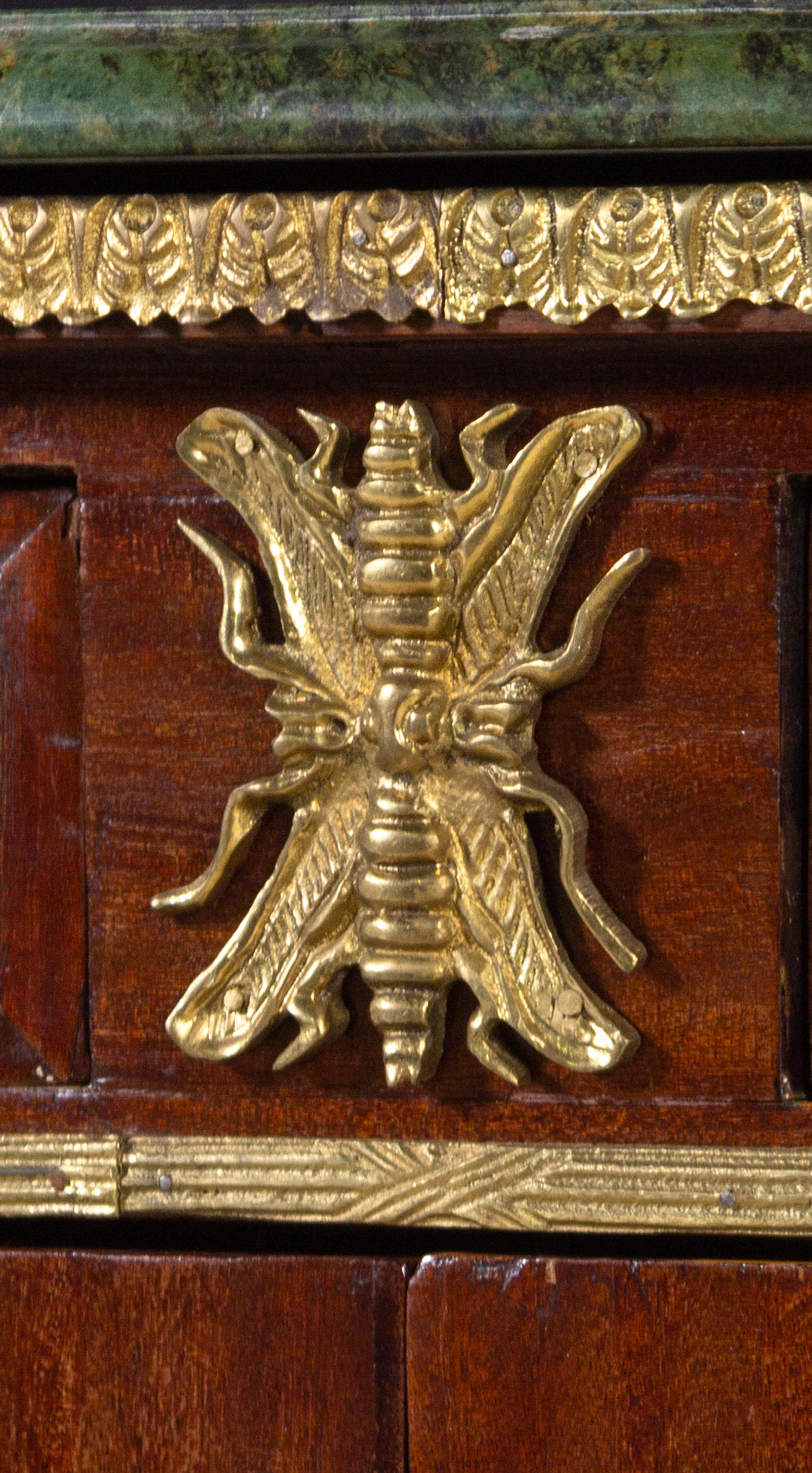 A Louis XVI Style Gilt Metal Mounted Mahogany Commode à Vantaux After the Model by Guillaume Benneman