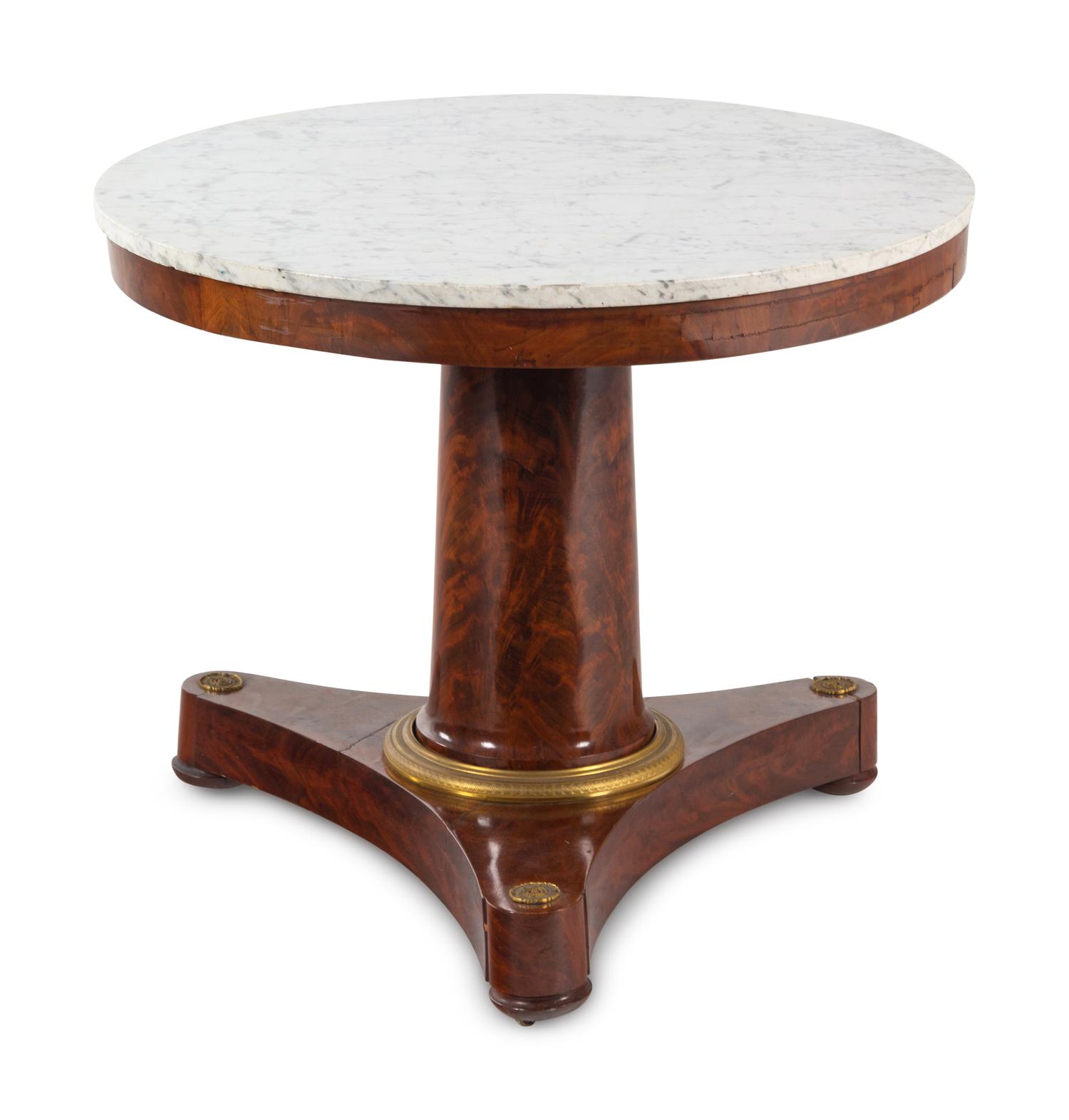 An Empire Gilt Bronze-Mounted Marble-Top Mahogany Center Table