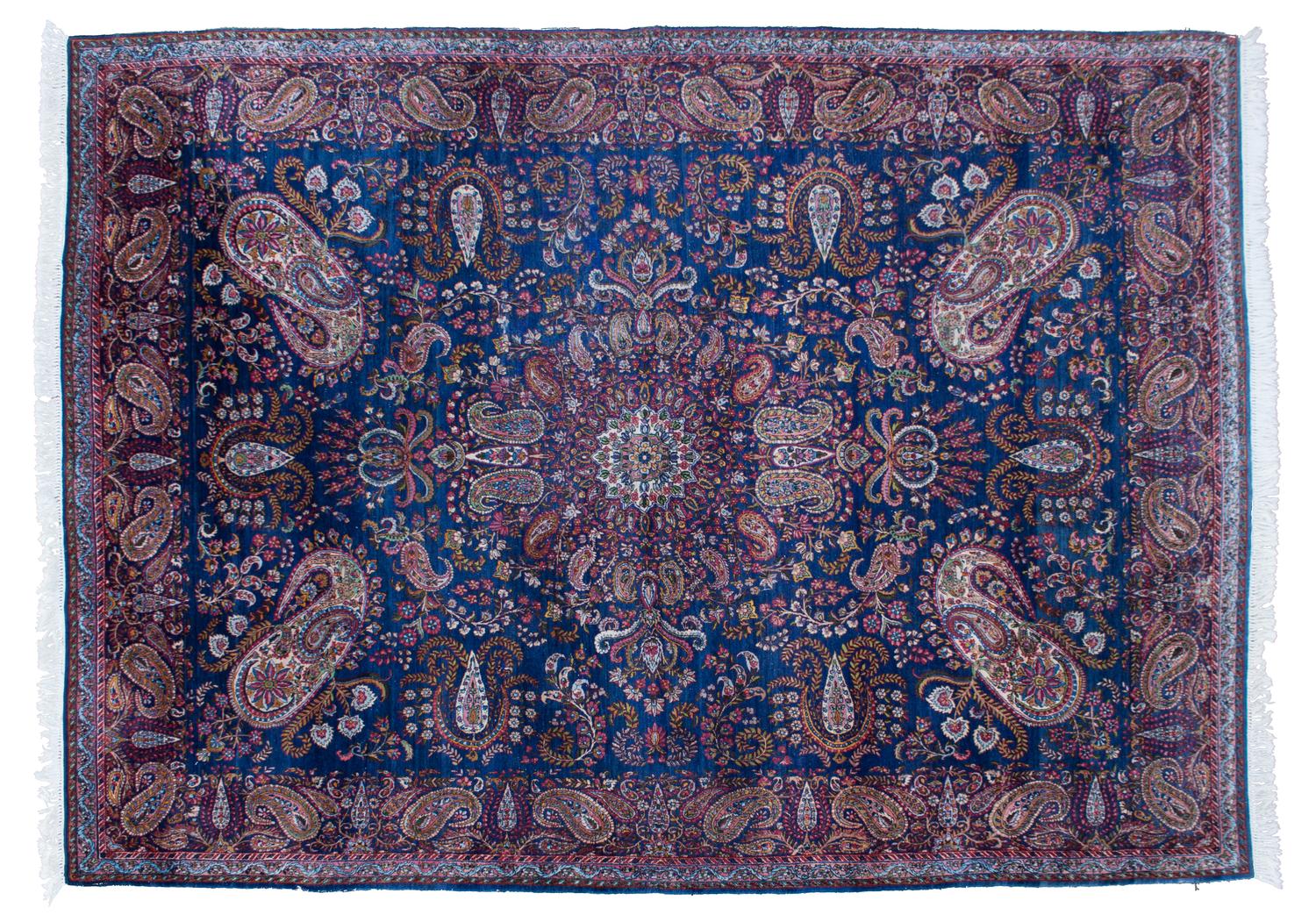 An Oriental Wool Rug 11 feet 7 1/2 inches x 8 feet 10 1/2 inches.