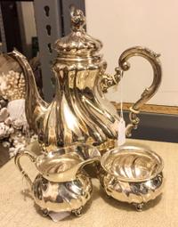 A German Silver Three-Piece Coffee Service, Various makers, each having a baluster form body with twist decoration and raised on four f
