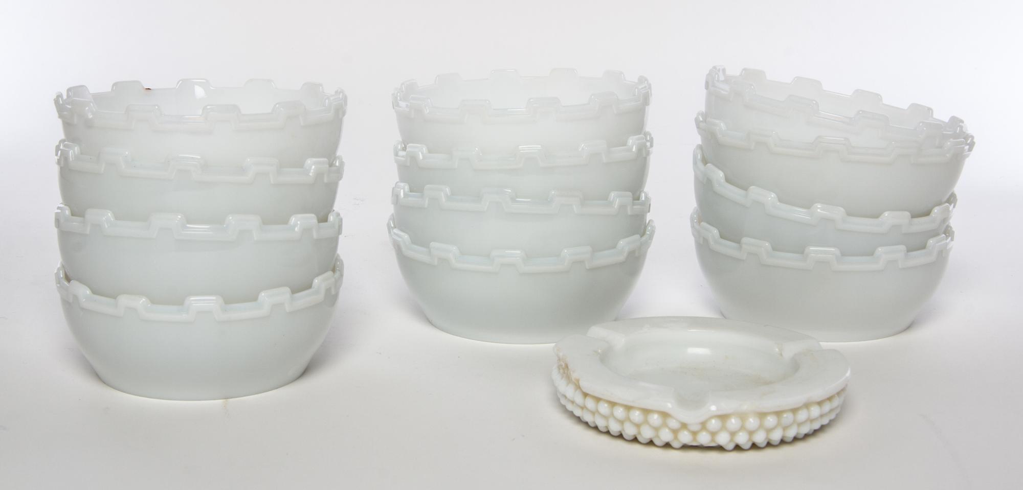 A Set of Twelve Milk Glass Bowls Height 1 3/4 inches.