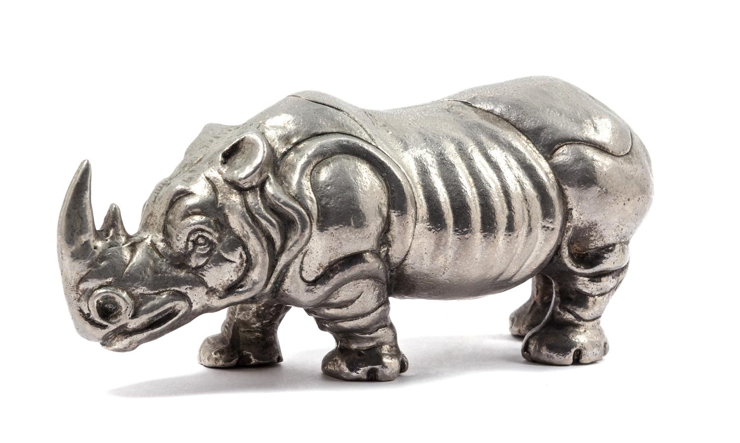 A Silvered Metal Figure of a Rhinoceros Length 10 3/4 inches. — 20TH CENUTRY