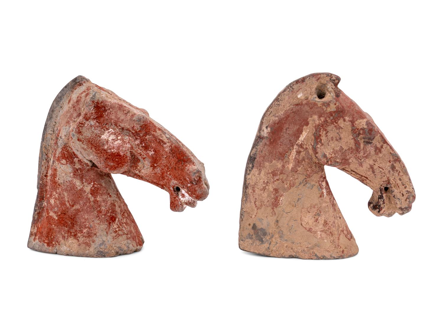 Two Chinese Red Glazed Pottery Horse Heads