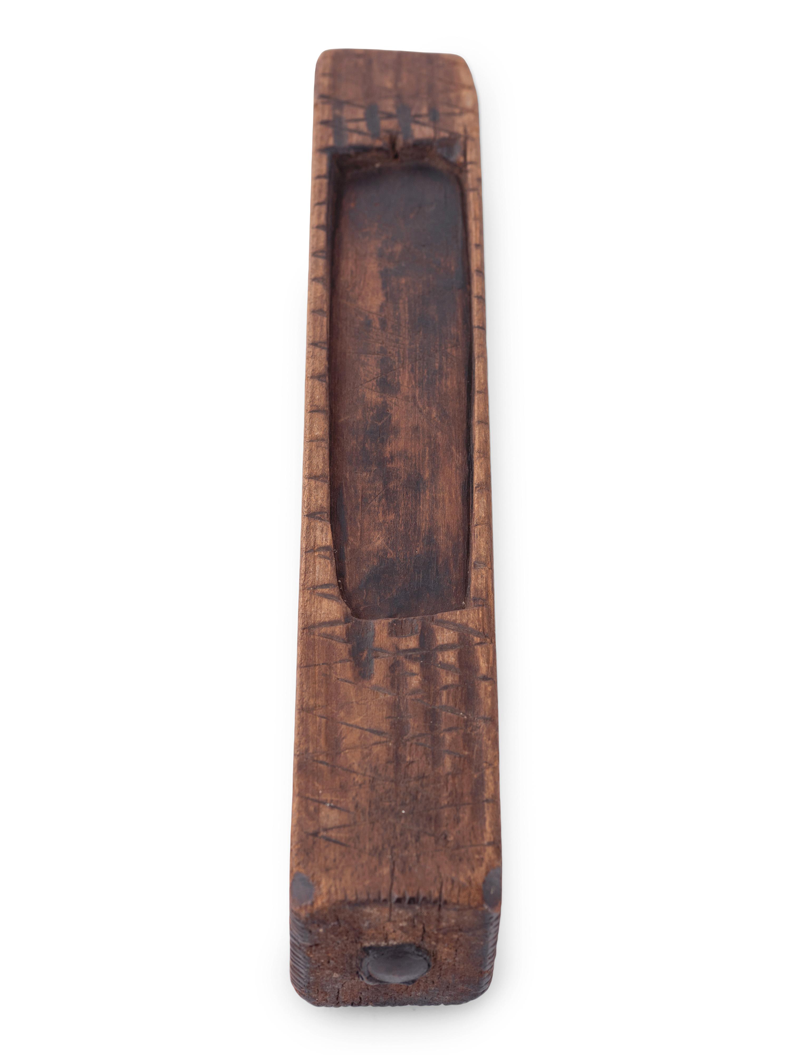 A Carved Wooden Folk Art Knife Sharpener