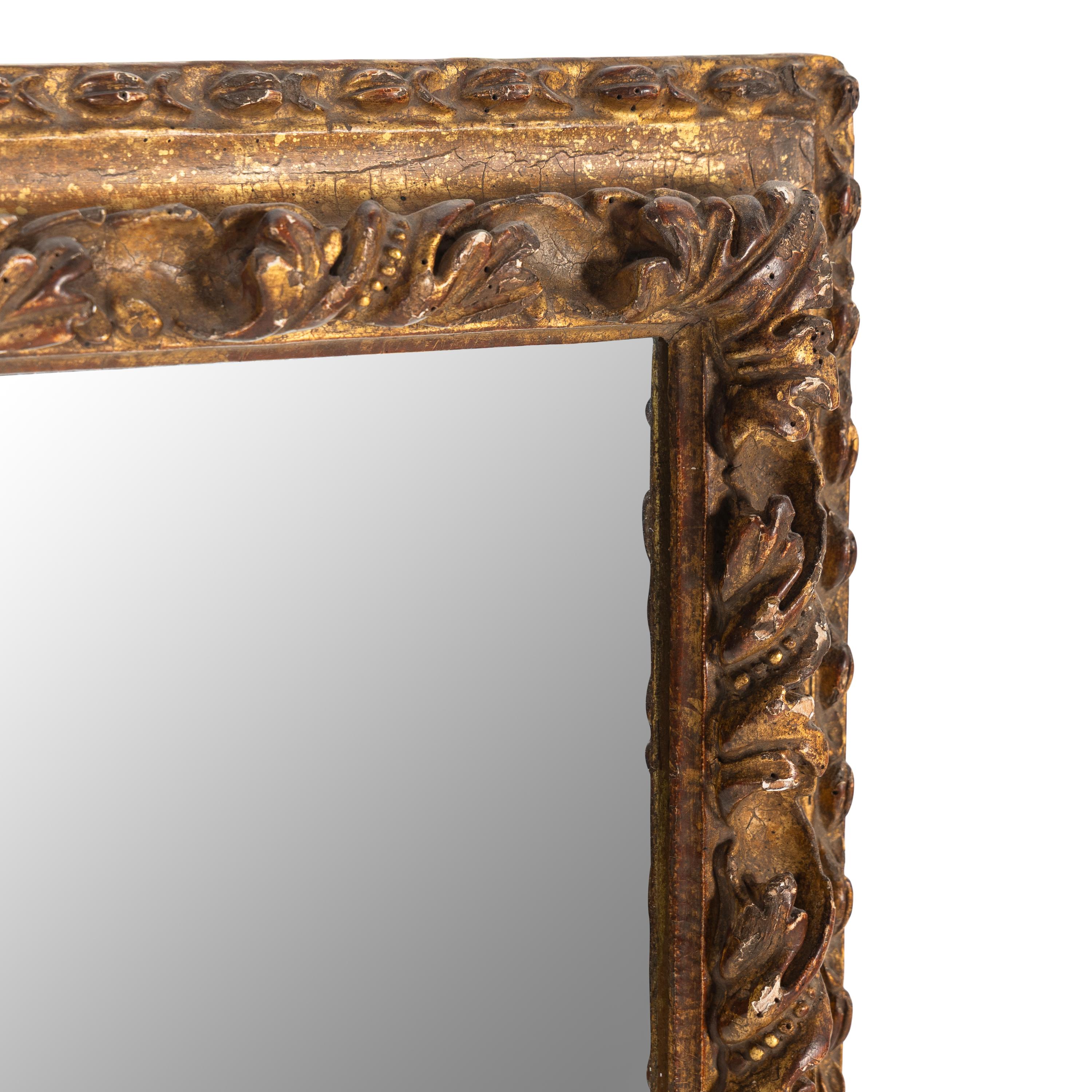 A Continental Carved Giltwood Mirror