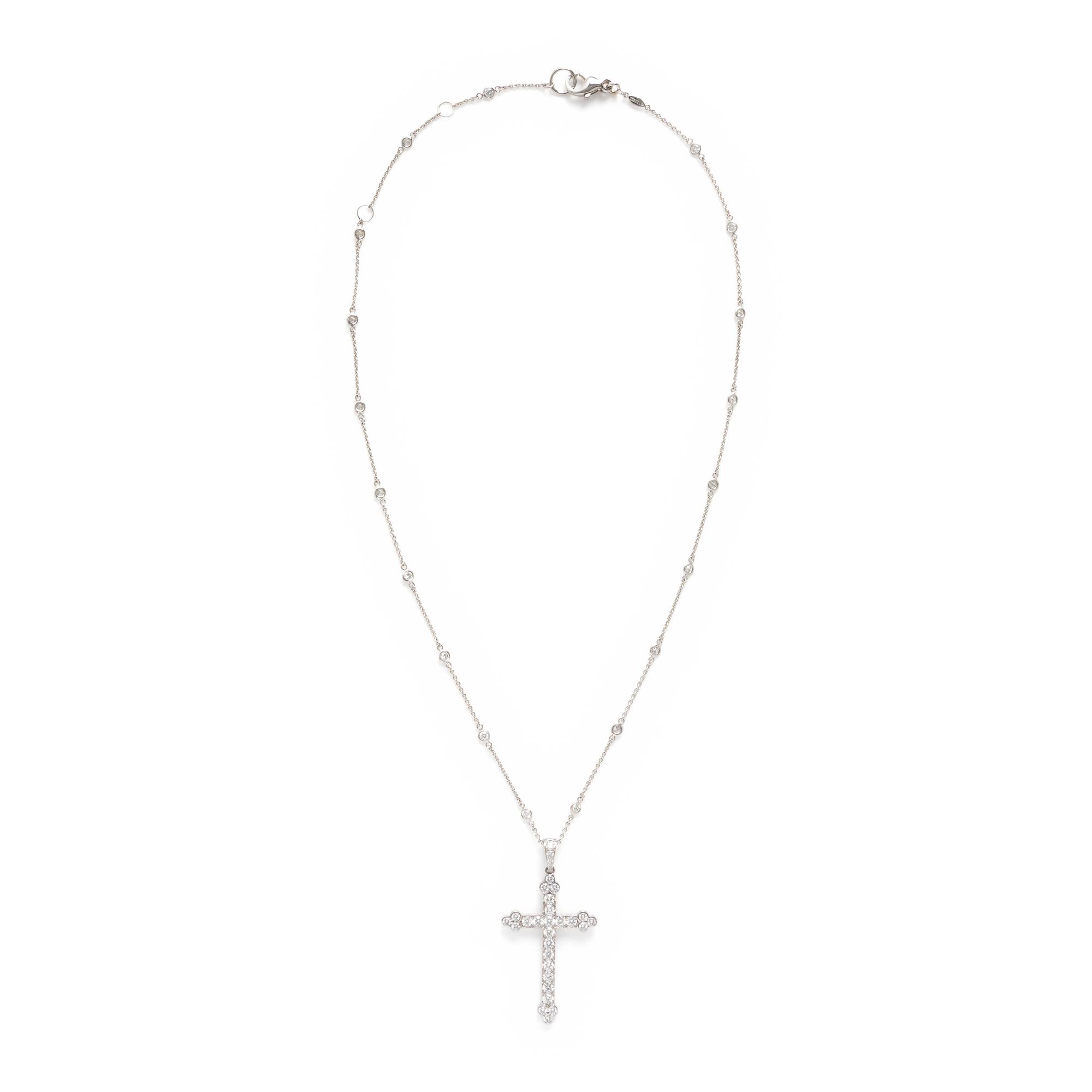 Cartier, Diamond and White Gold Cross Pendant with a Roberto Coin Diamond Station Chain Necklace