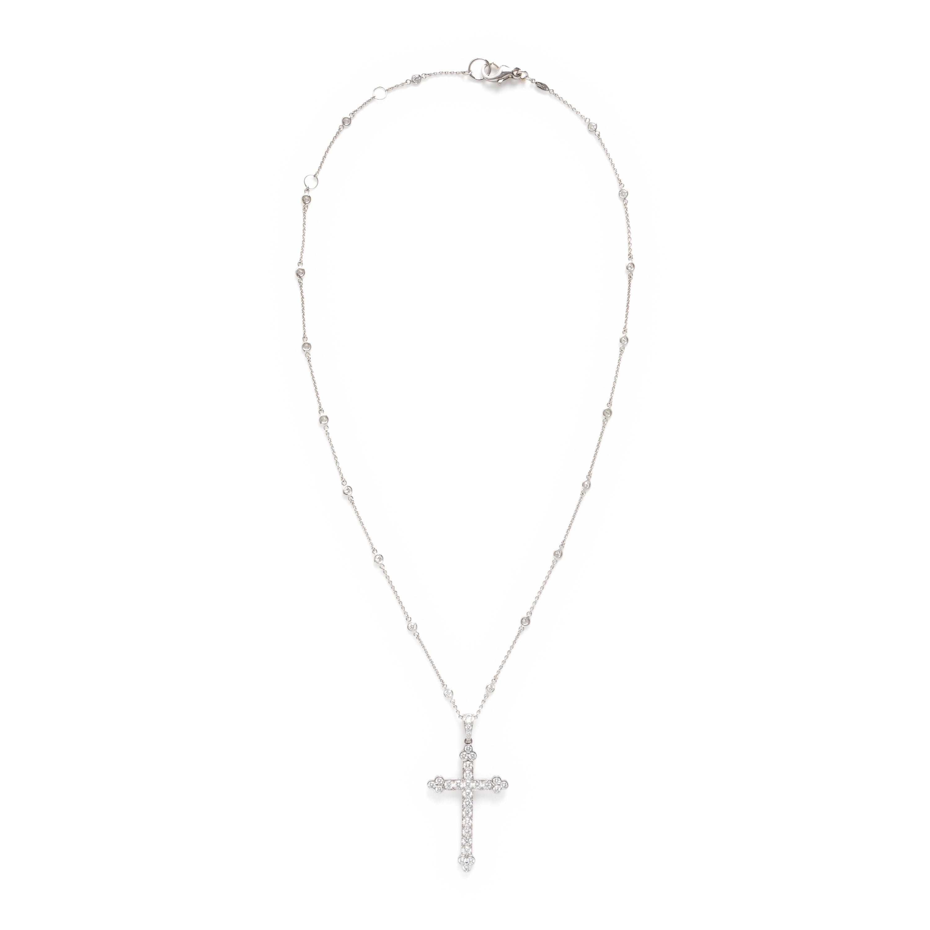 Cartier, Diamond and White Gold Cross Pendant with a Roberto Coin Diamond Station Chain Necklace