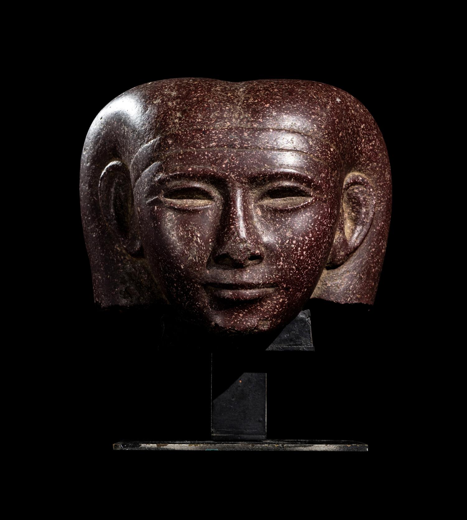 A Roman Porphyry Head of an Egyptian Woman