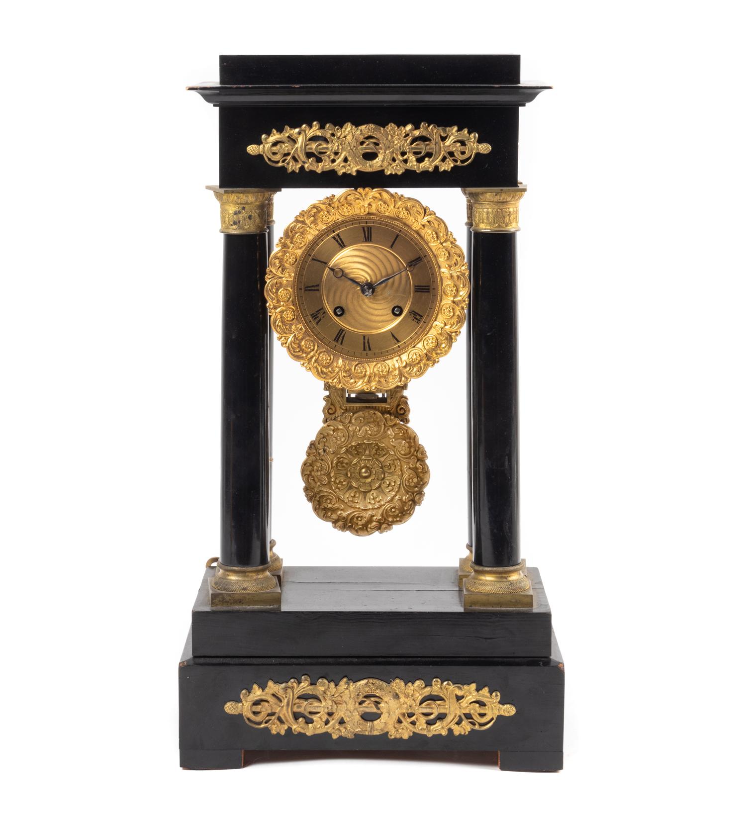 An Empire Style Gilt Metal Mounted Ebonized Mantel Clock