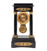 An Empire Style Gilt Metal Mounted Ebonized Mantel Clock
