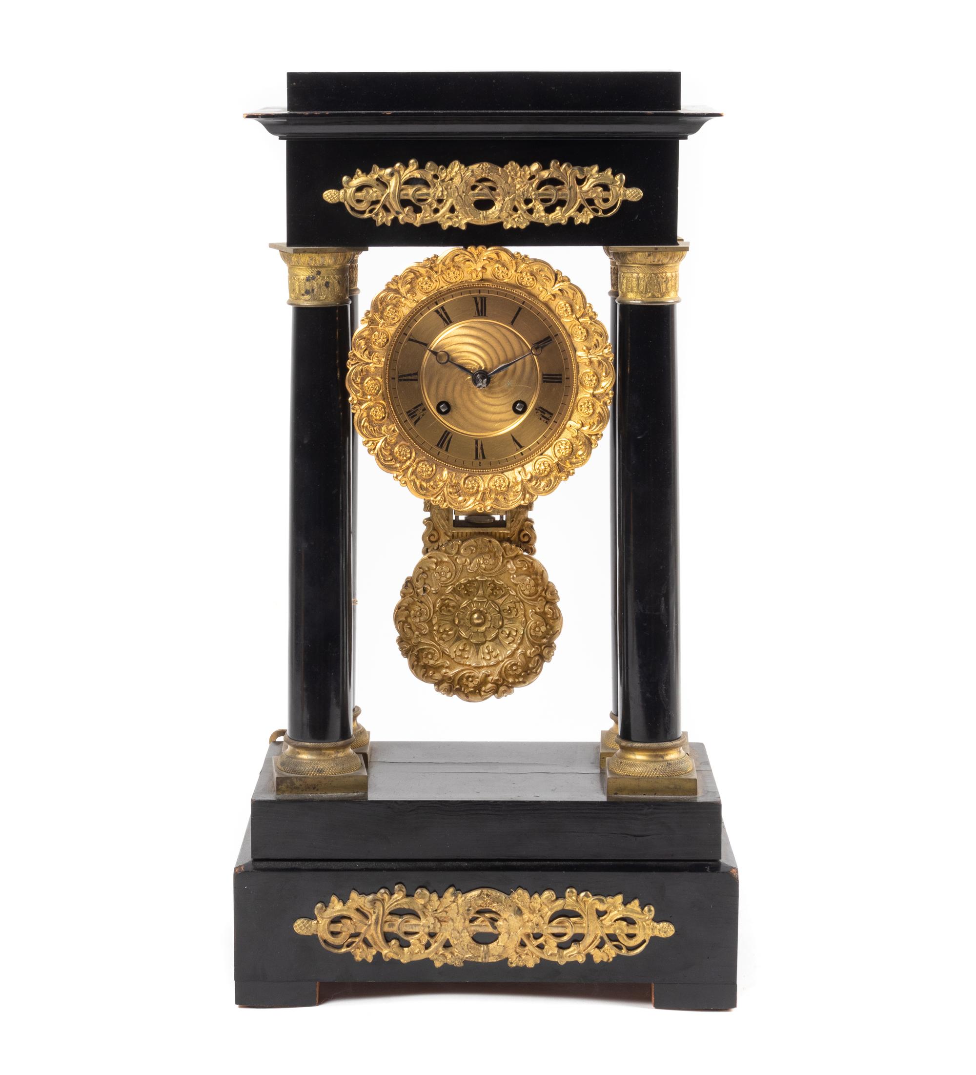 An Empire Style Gilt Metal Mounted Ebonized Mantel Clock