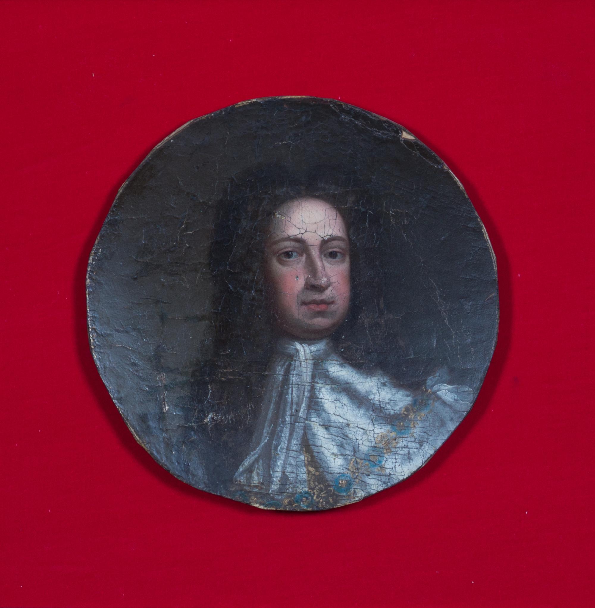 A Pair of Framed Portrait Fragments Diameter of each 9 inches.