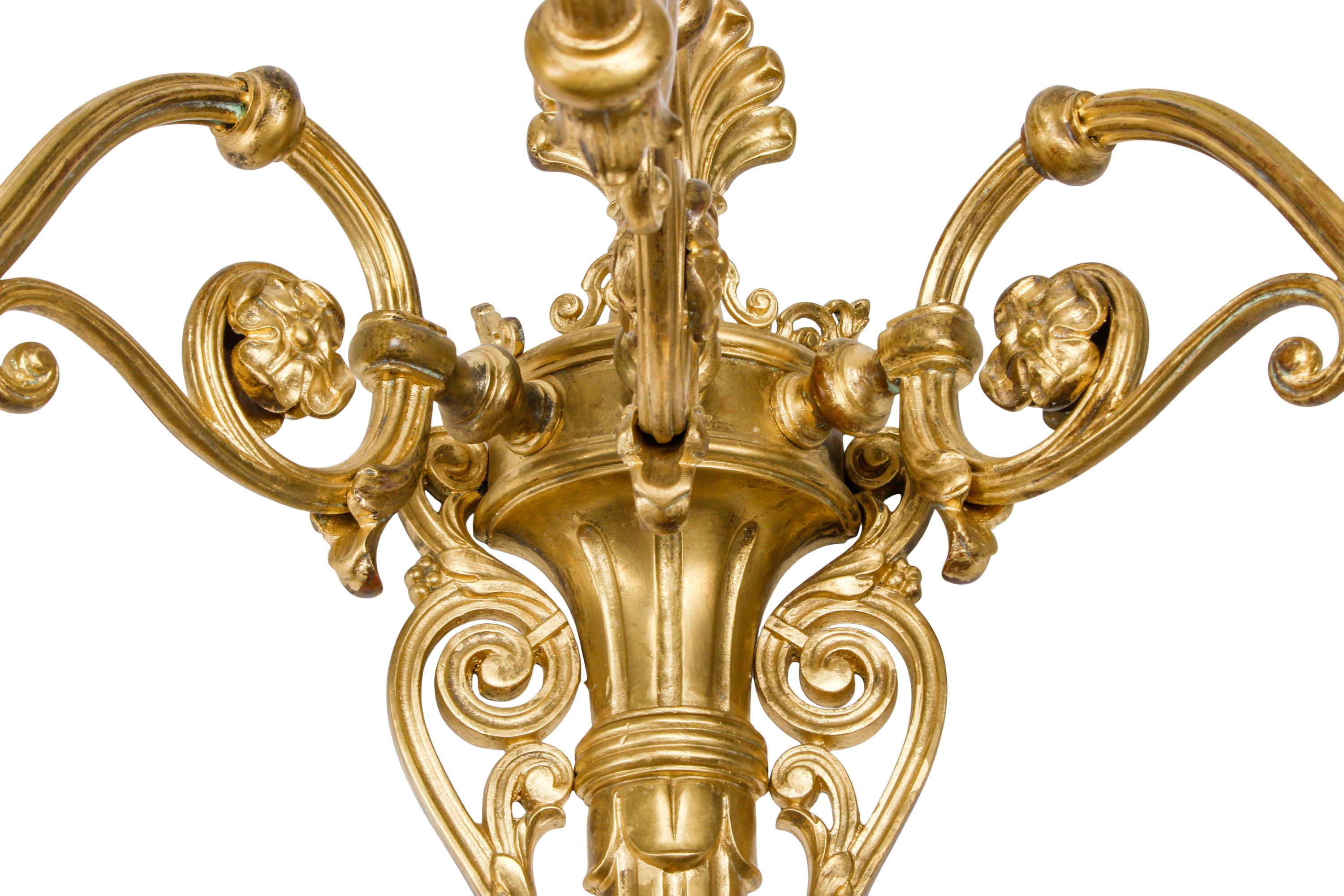 A Set of Four Large Gilt Bronze Three-Light Sconces