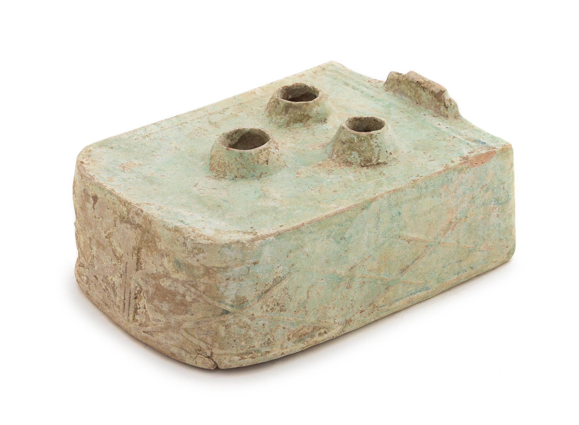 A Chinese Green Glazed Pottery Model of a Stove Length 8 3/4 x width 6 1/2 x height 3 inches. — HAN DYNASTY (206 B.C. - A.D. 220)