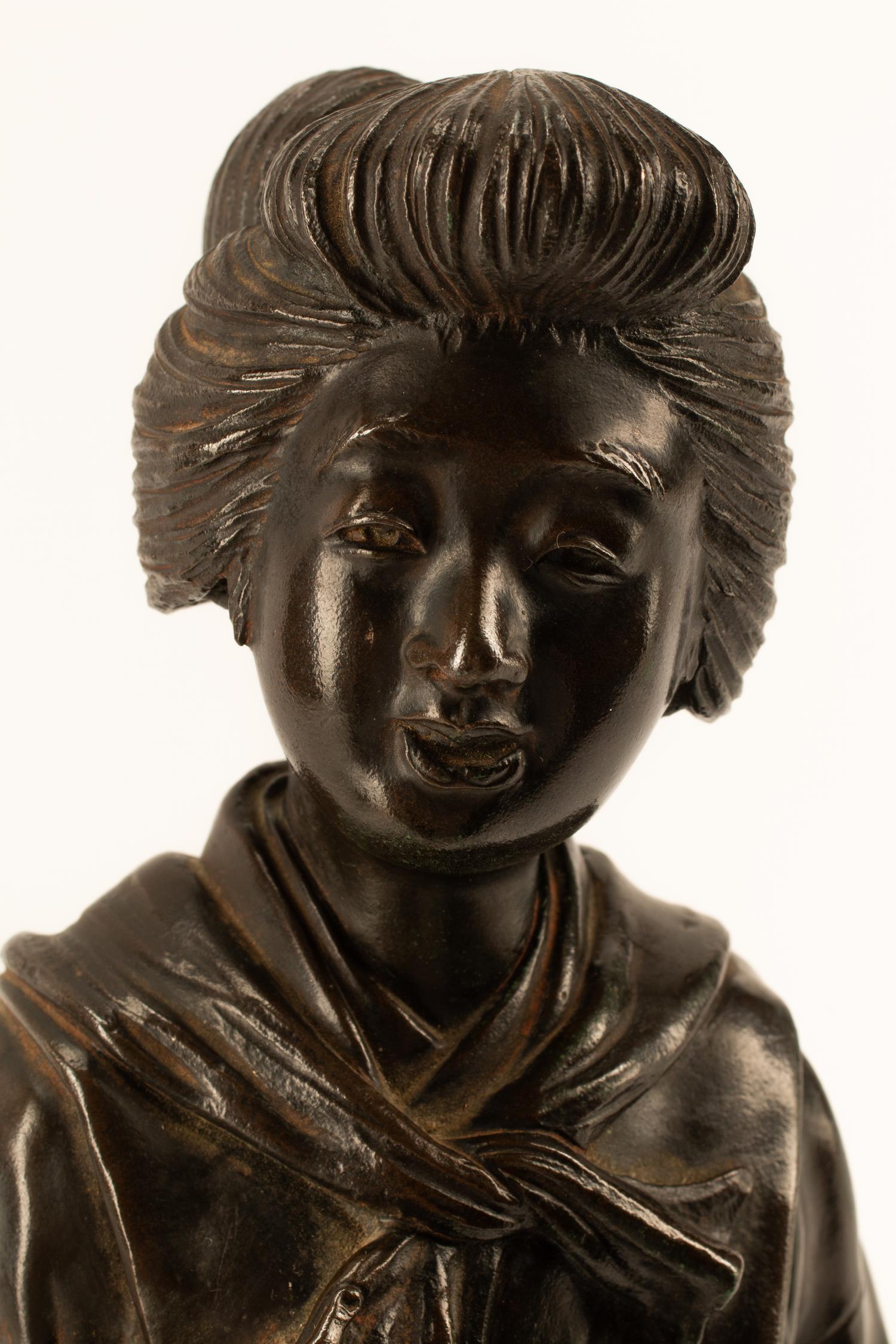 A Japanese Parcel Gilt Bronze Figure of a Lady