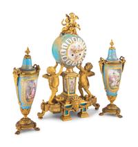 A Sèvres Style Porcelain and Gilt Bronze Mounted Three-Piece Clock Garniture