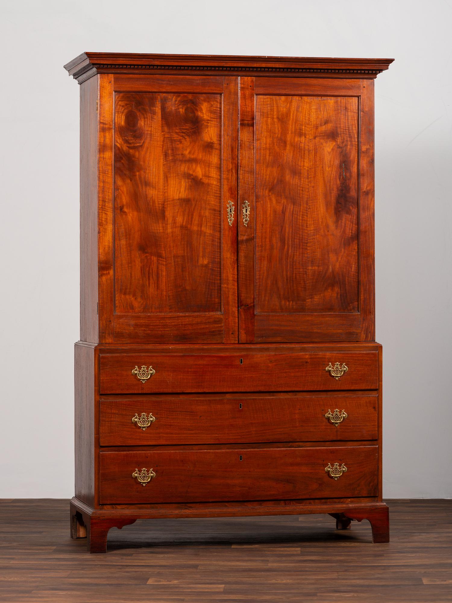 A Chippendale Figured Mahogany Linen Press