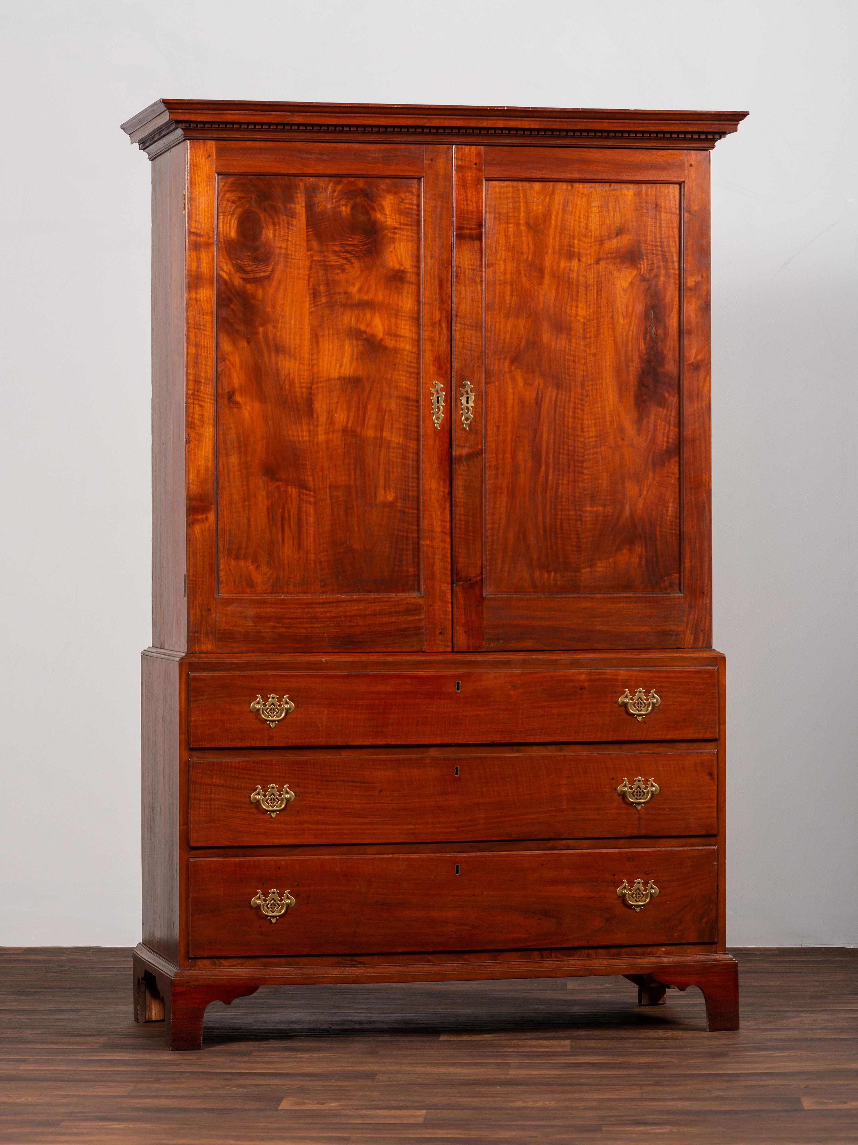 A Chippendale Figured Mahogany Linen Press