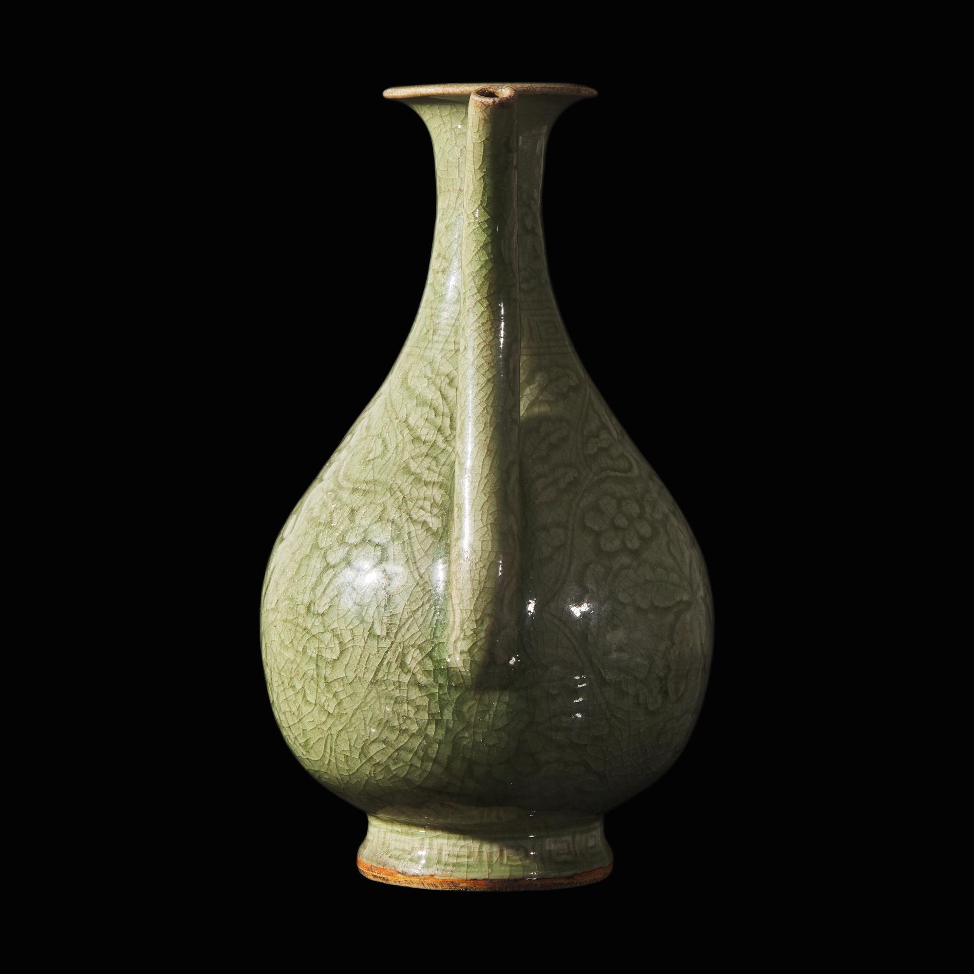 A Chinese Celadon-Glazed Porcelain Ewer, Possibly Ming Dynasty 或為明 青釉刻花執壺