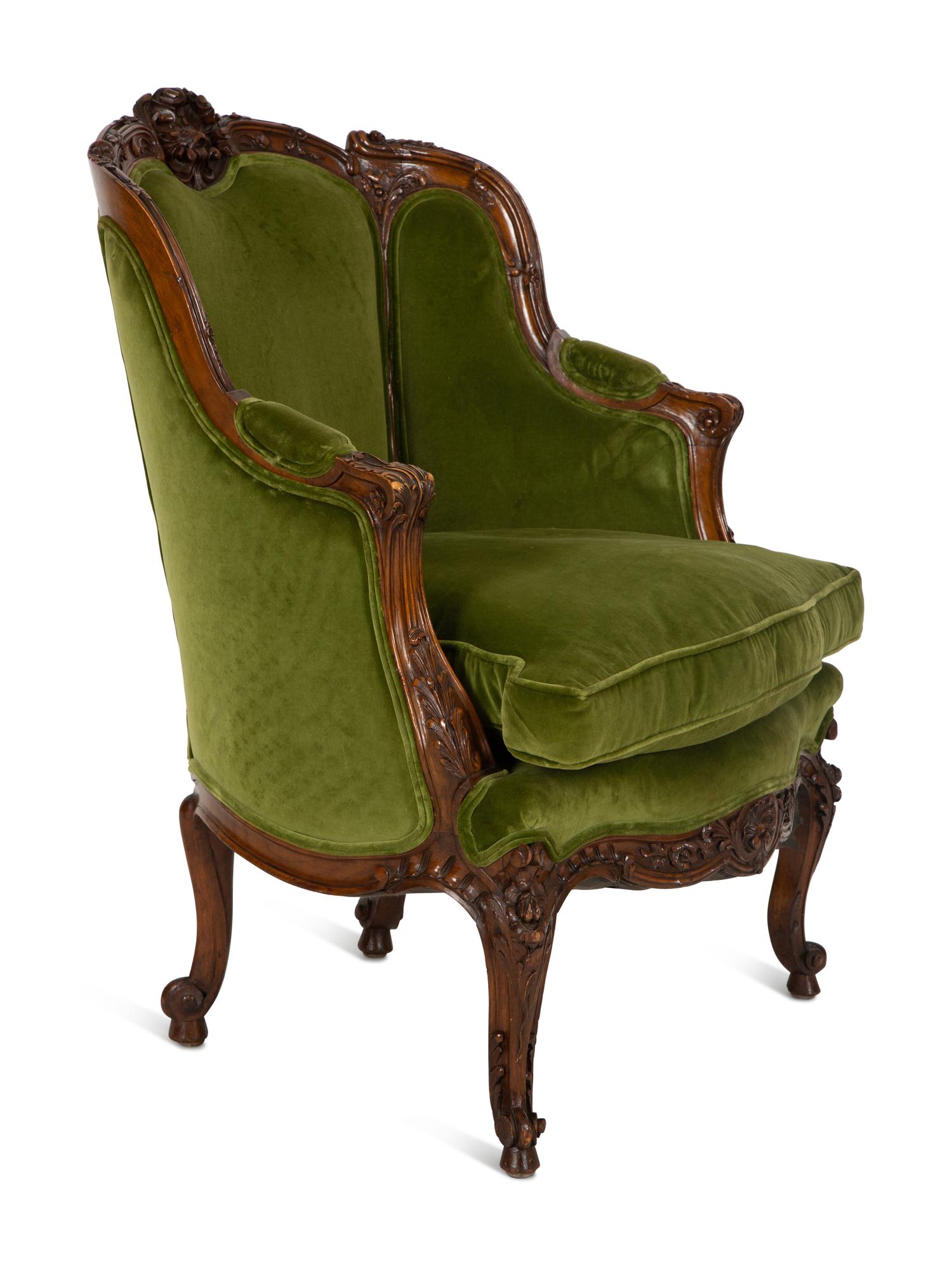 A Louis XV Style Carved Fruitwood Bergère à Oreilles