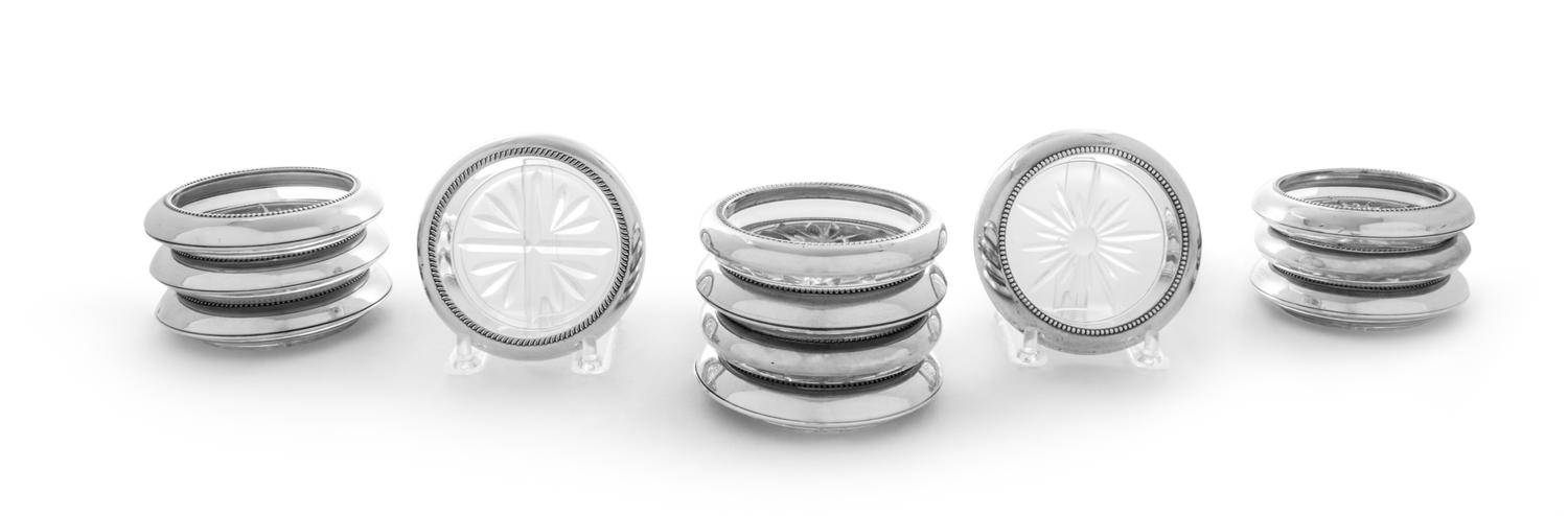 Twelve Sterling Silver and Glass Coasters Diameter 3 3/4 inches.