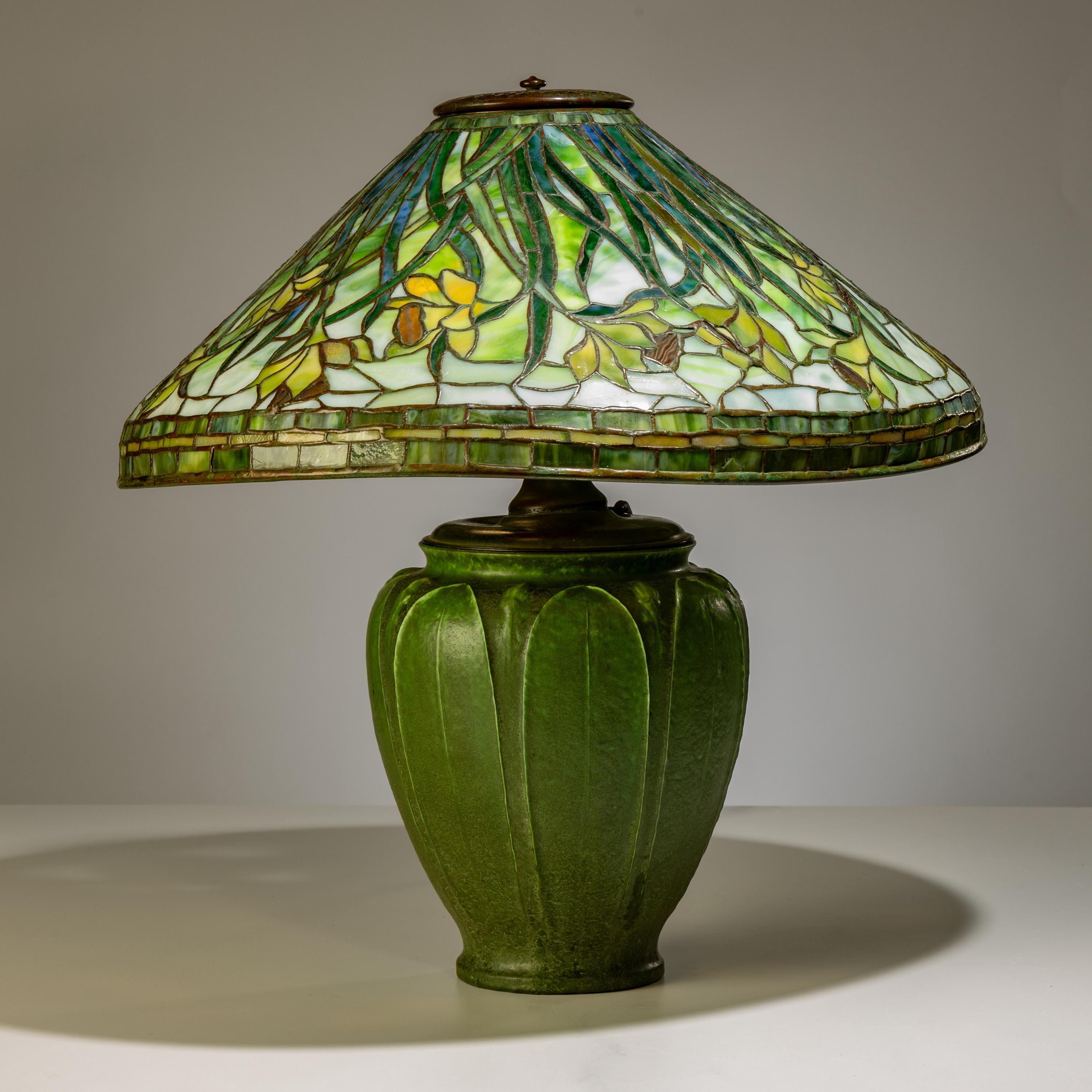 Tiffany Studios New York (American, 1892–1930) — Swirling Daffodil Table Lamp with Grueby Pottery Base