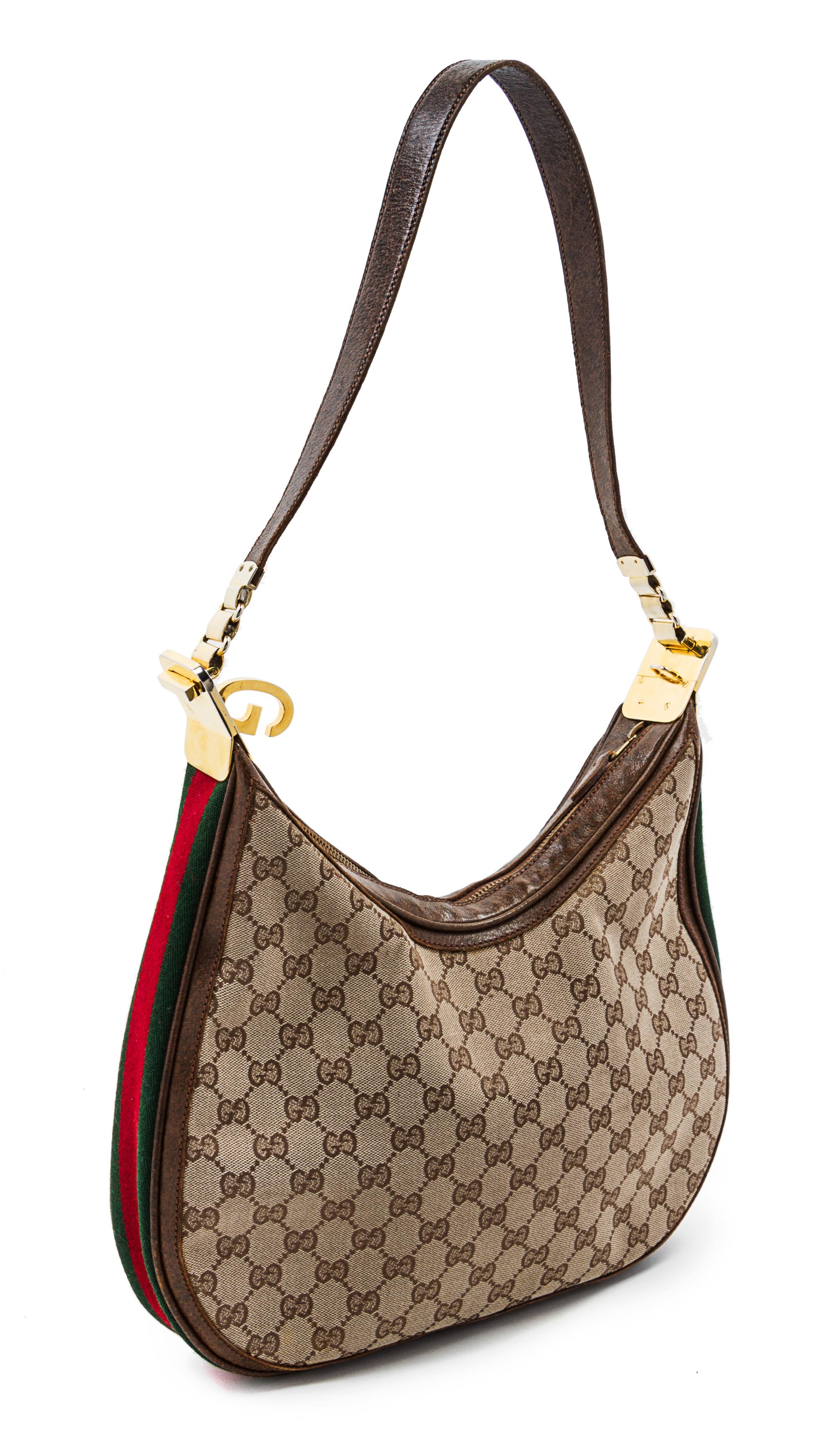 A Gucci Monogram Canvas Bag, 13 x 11 x 2 1/2 inches.
