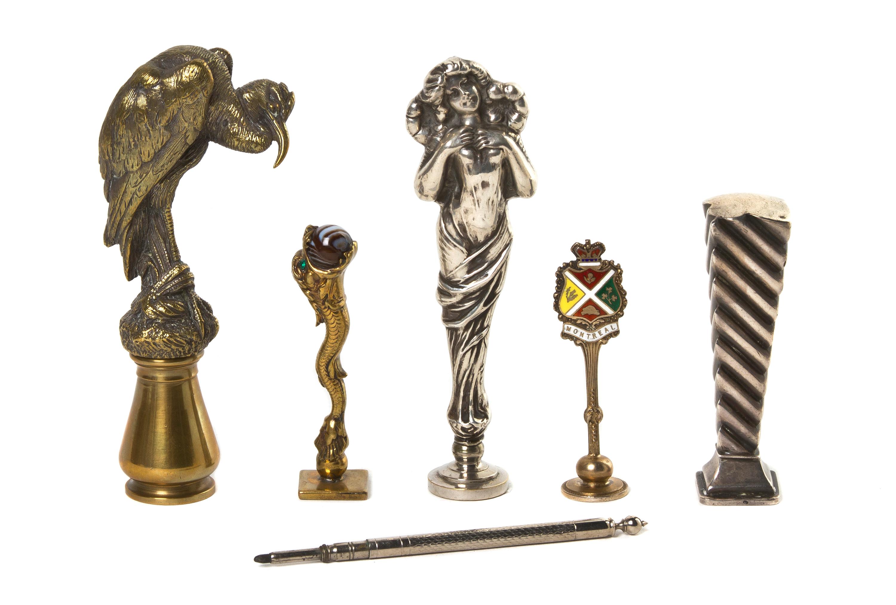 A Collection of Silvered and Cast Metal Seals, Height of tallest 4 1/4 inches.