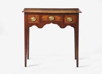 A George III provincial carved oak dressing table, late 18th century