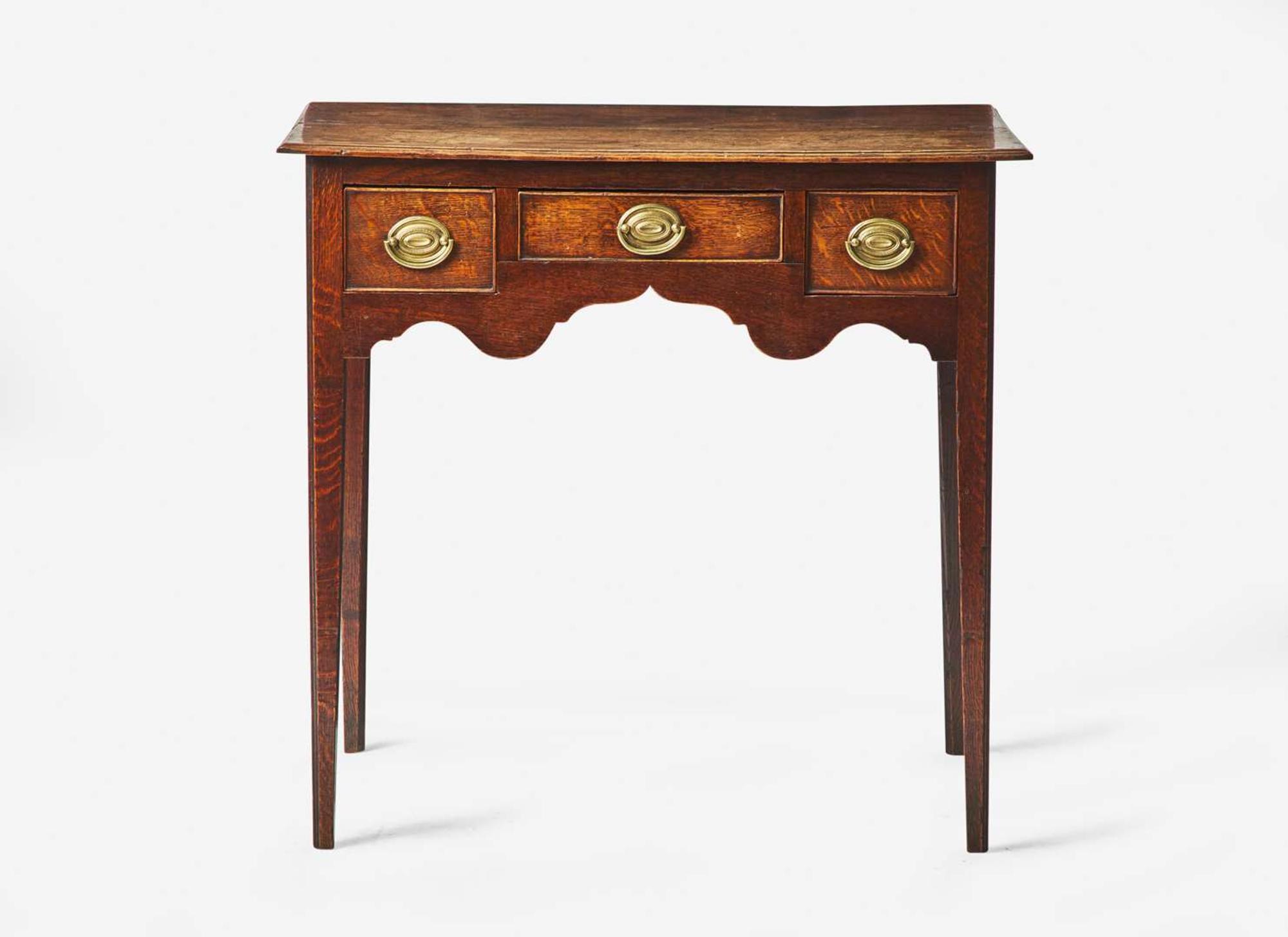A George III provincial carved oak dressing table, late 18th century