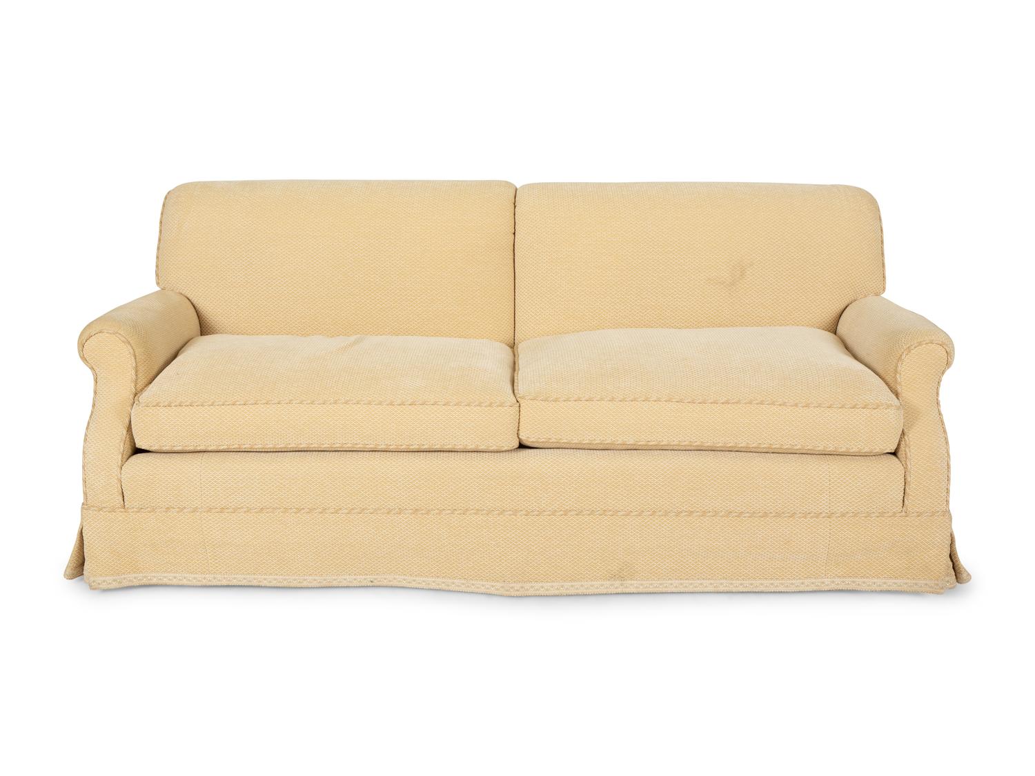 A Pair of Ivory Upholstered Three Cushion Sofas — 20th Century