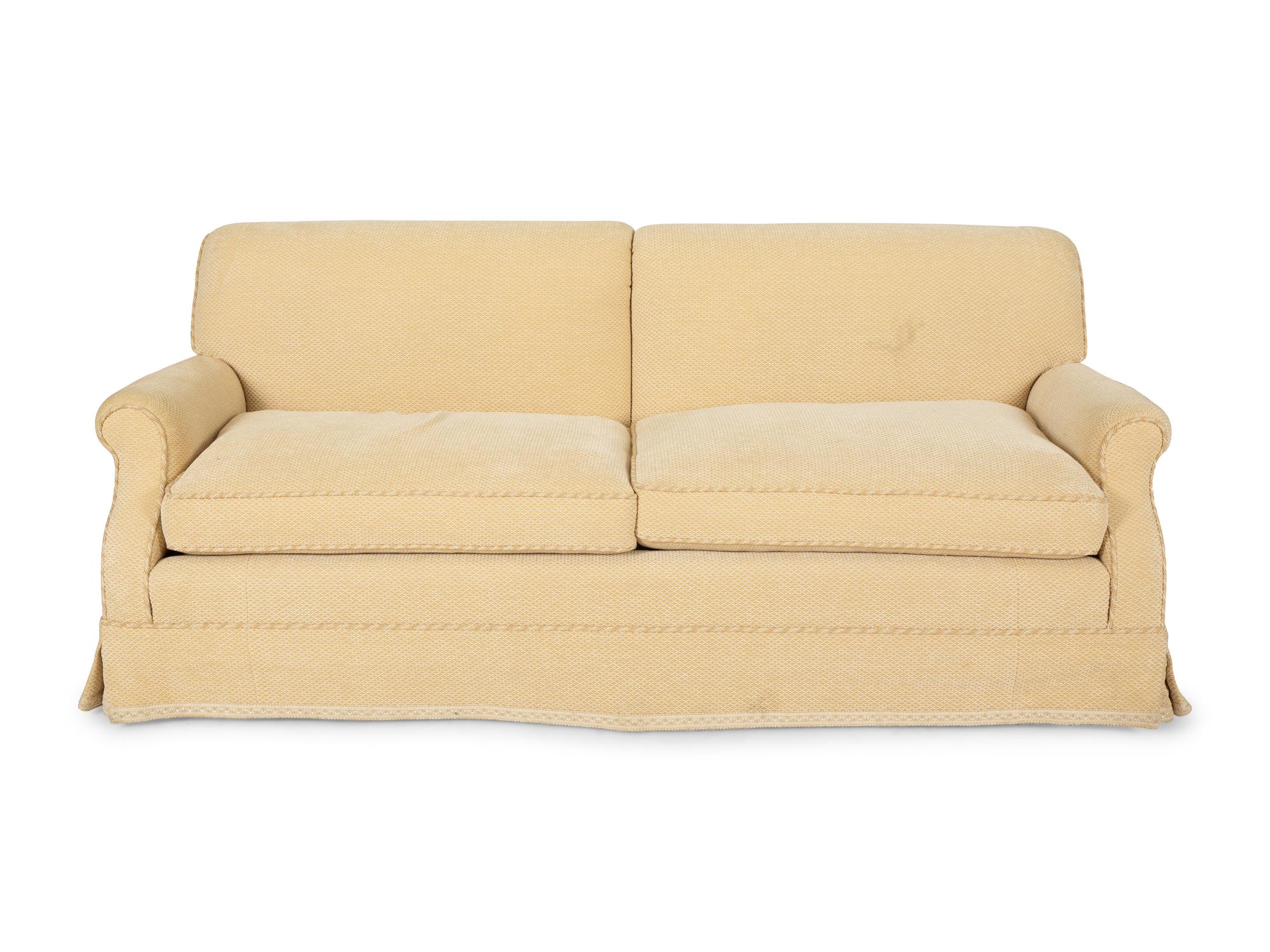 A Pair of Ivory Upholstered Three Cushion Sofas — 20th Century