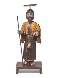 A Carved and Painted Wood and Plaster Santos Figure