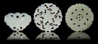 Three Carved Jade Pendants Diameter of first 2 1/4 inches.