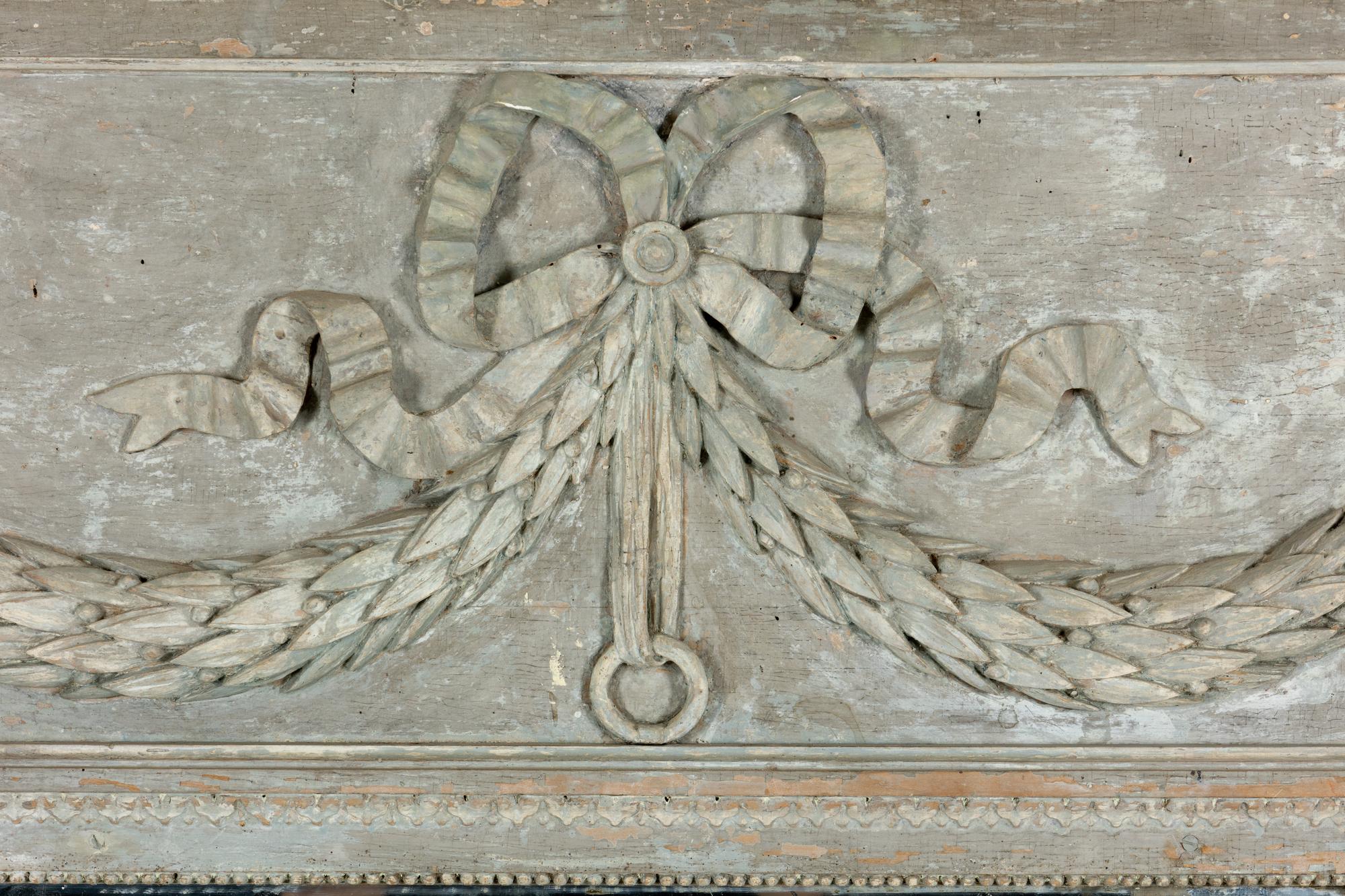 A Louis XVI Grey-Painted and Carved Trumeau