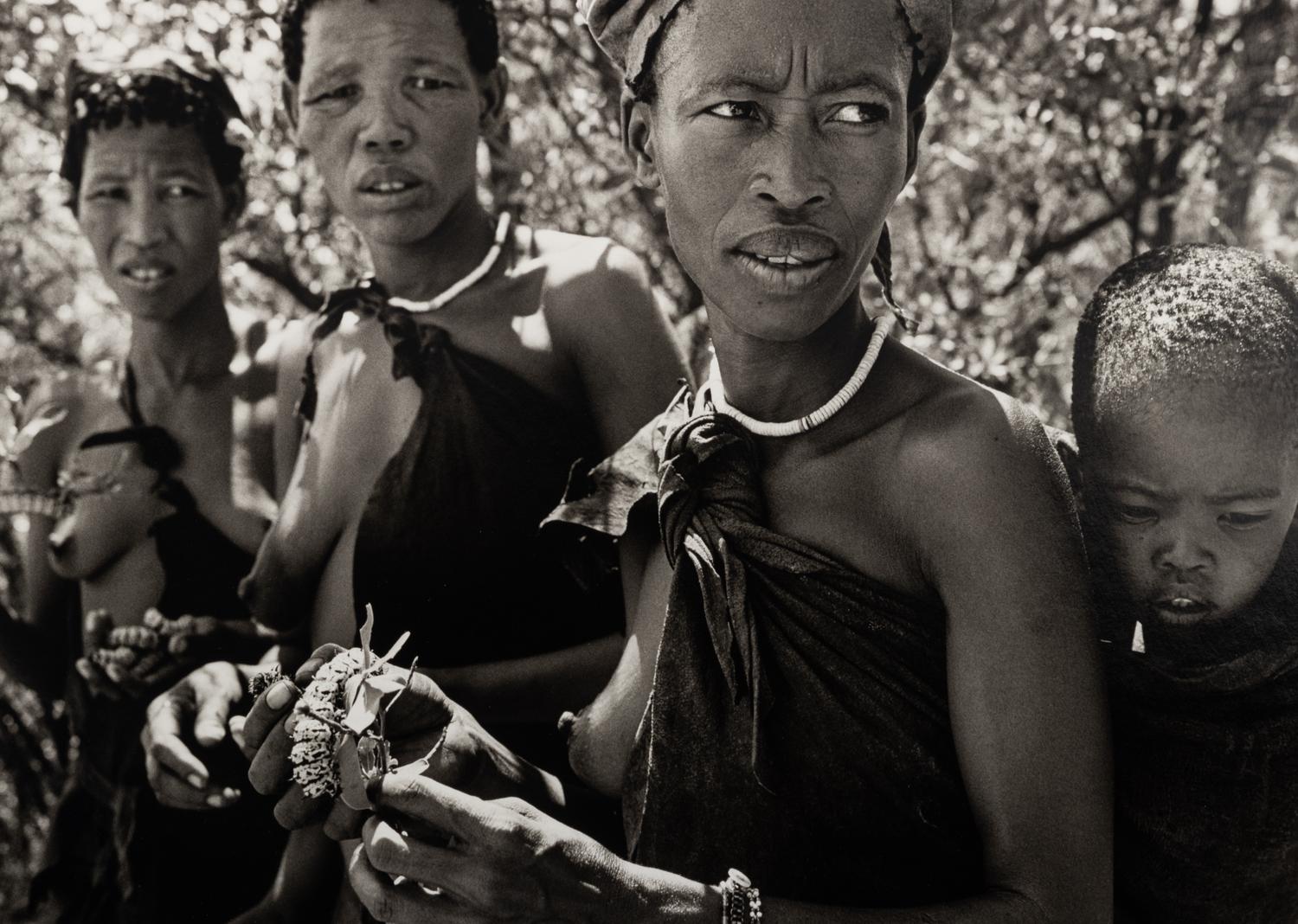 Sebastião Salgado (born 1944) Bushmen women collecting caterpillars in the Kalahari Desert. Botswana, Africa, 2008