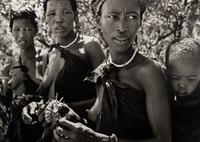 Sebastião Salgado (born 1944) Bushmen women collecting caterpillars in the Kalahari Desert. Botswana, Africa, 2008