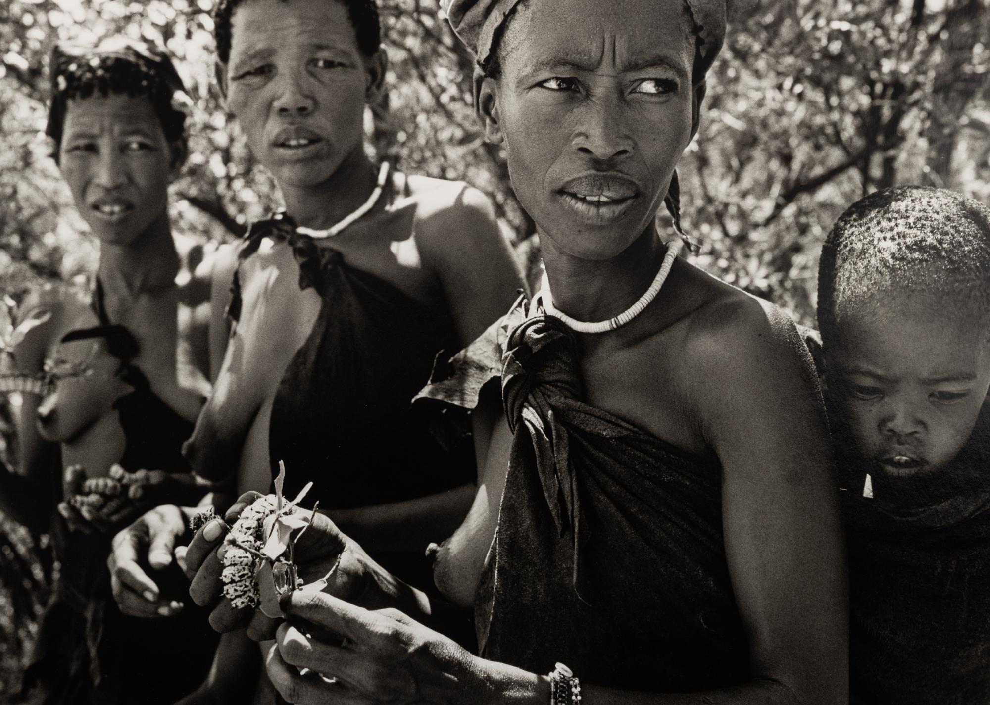 Sebastião Salgado (born 1944) Bushmen women collecting caterpillars in the Kalahari Desert. Botswana, Africa, 2008