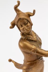A French Gilt Bronze Figure of a Harlequin on an Onyx Base