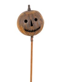 A Painted Tin Jack O' Lantern Ornament