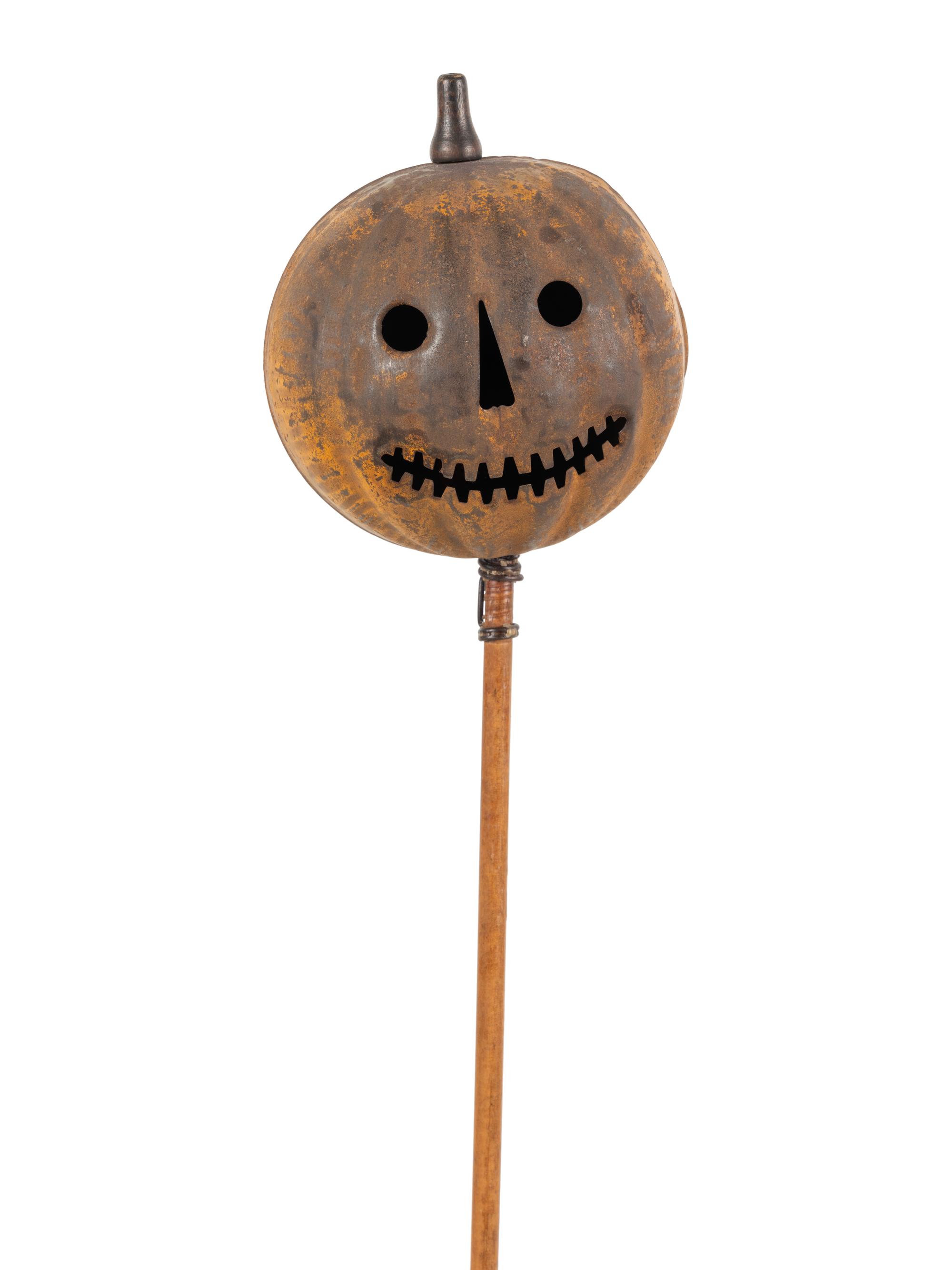 A Painted Tin Jack O' Lantern Ornament