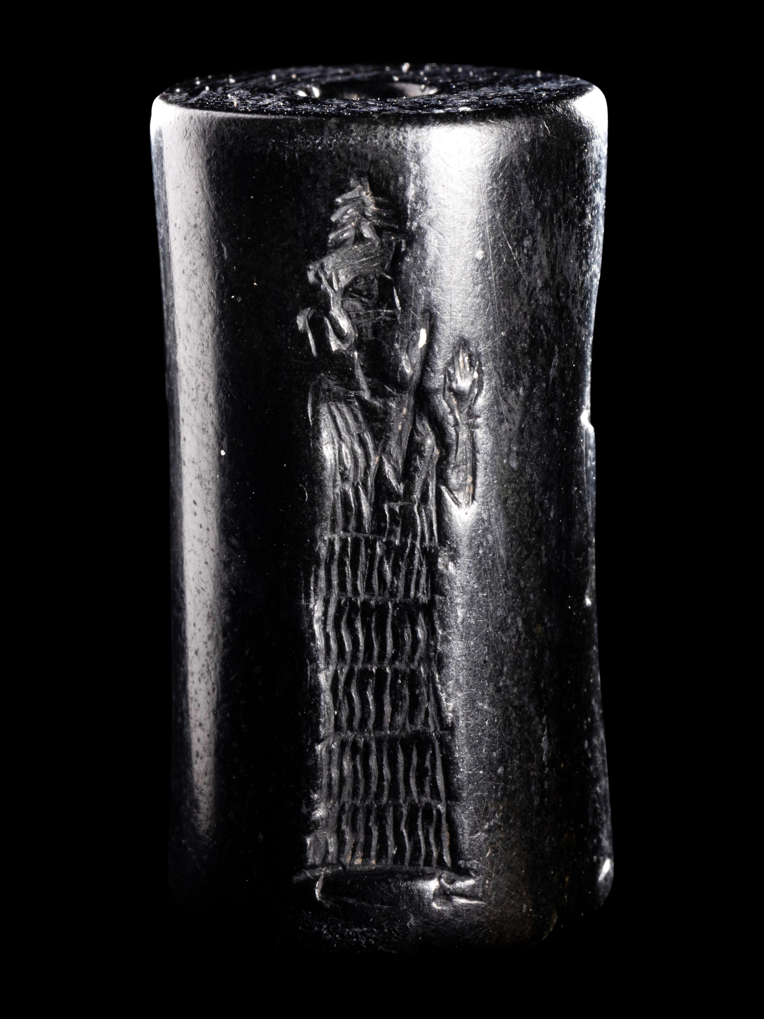 A Mesopotamian Hematite Cylinder Seal