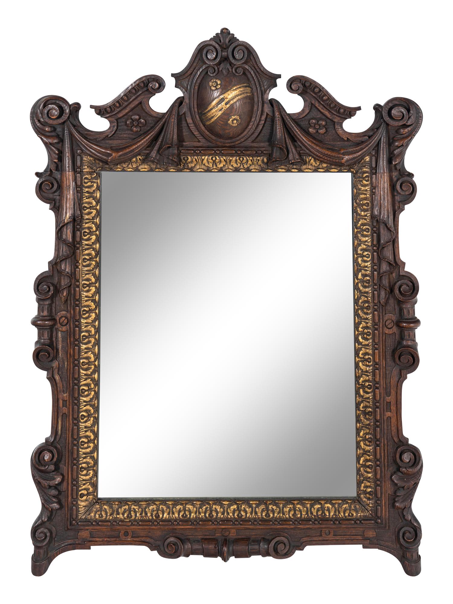 A Continental Parcel Gilt Oak Mirror