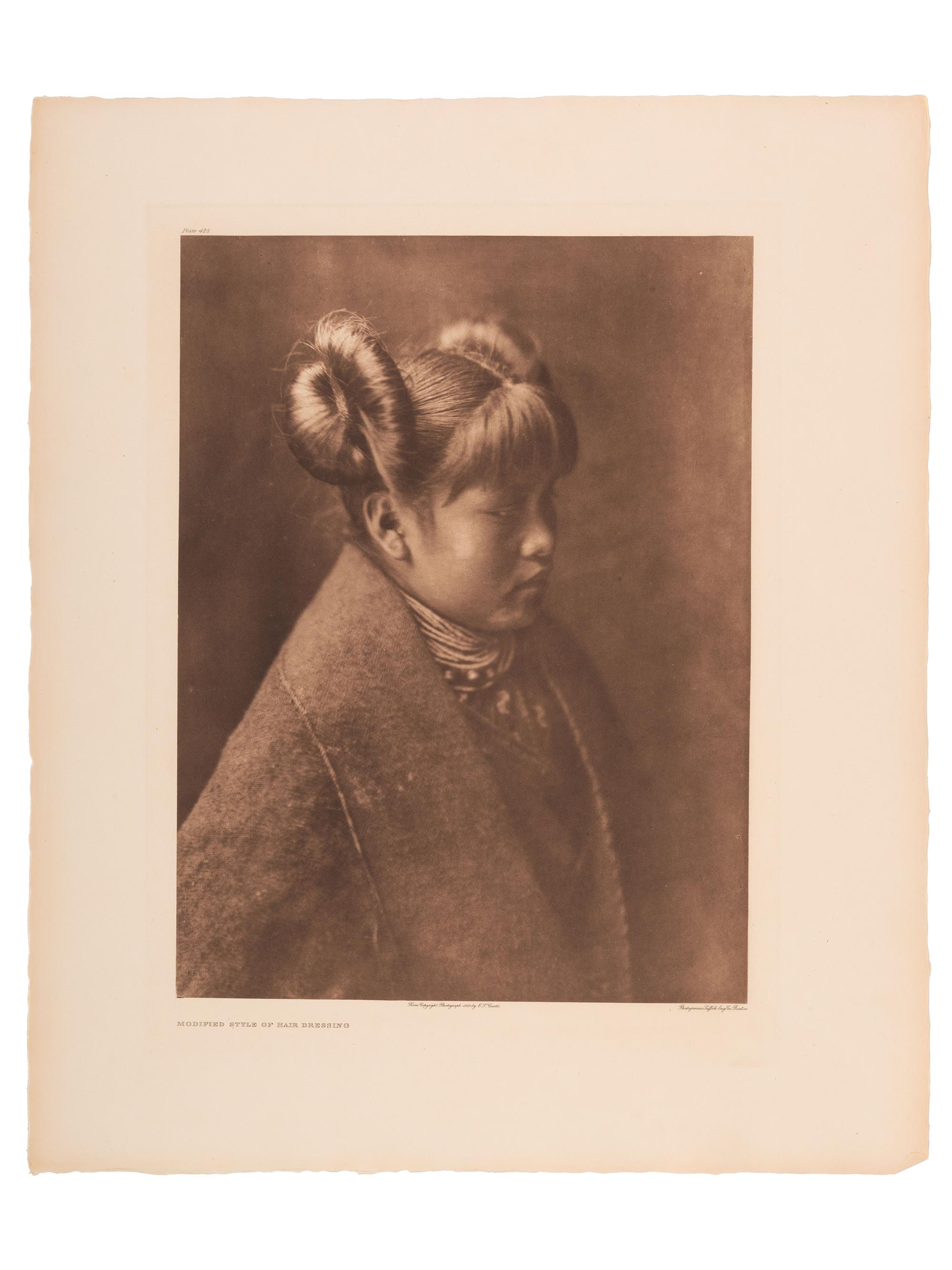 CURTIS, Edward (1868-1952). A group of 2 portfolio photogravures featuring female Hopi subjects modeling traditional and modified hair styles.
