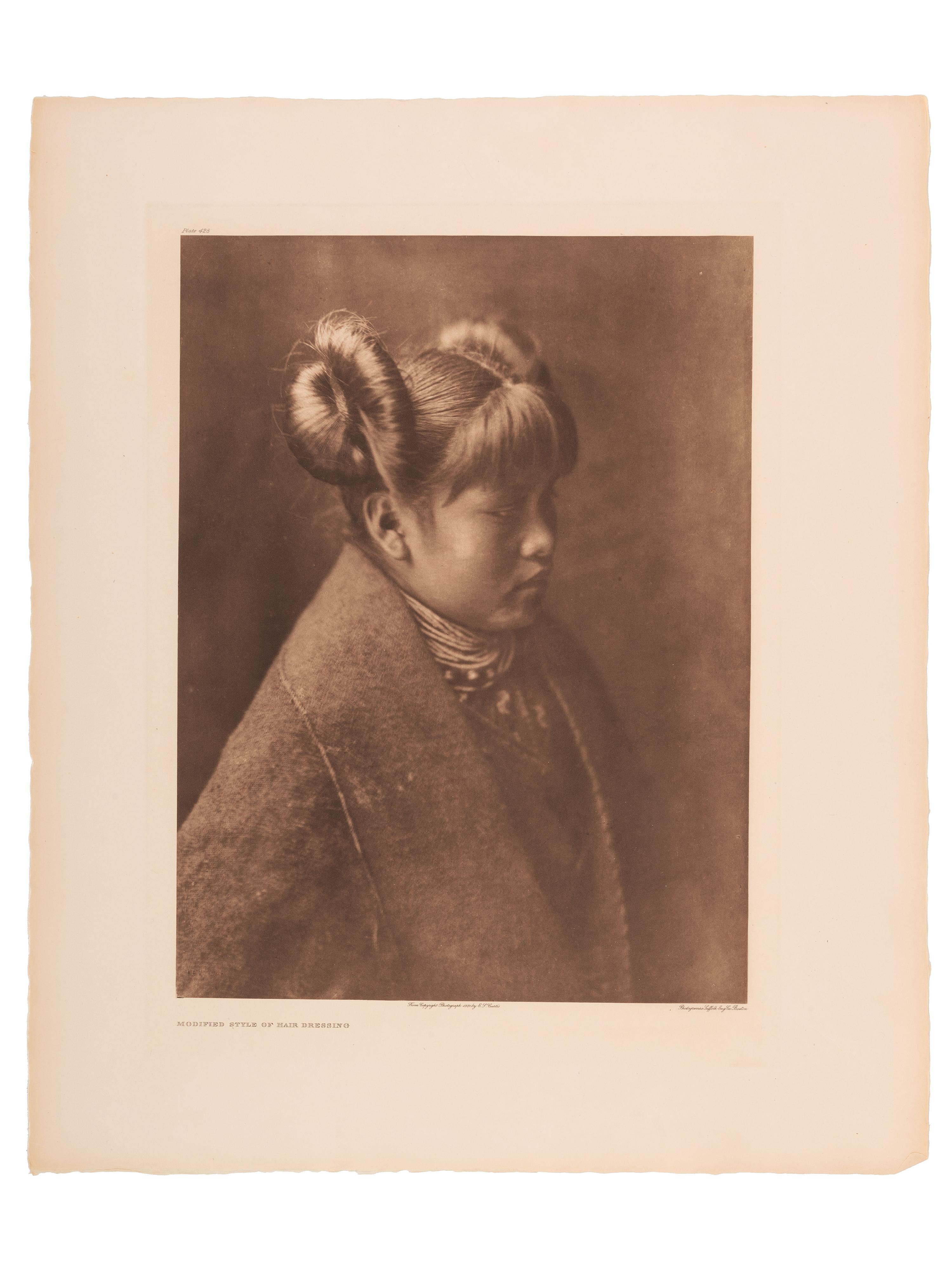 CURTIS, Edward (1868-1952). A group of 2 portfolio photogravures featuring female Hopi subjects modeling traditional and modified hair styles.
