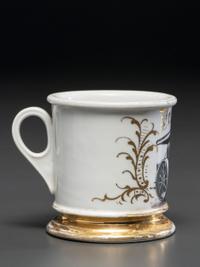 A Porcelain Shaving Mug Depicting a Steam Roller